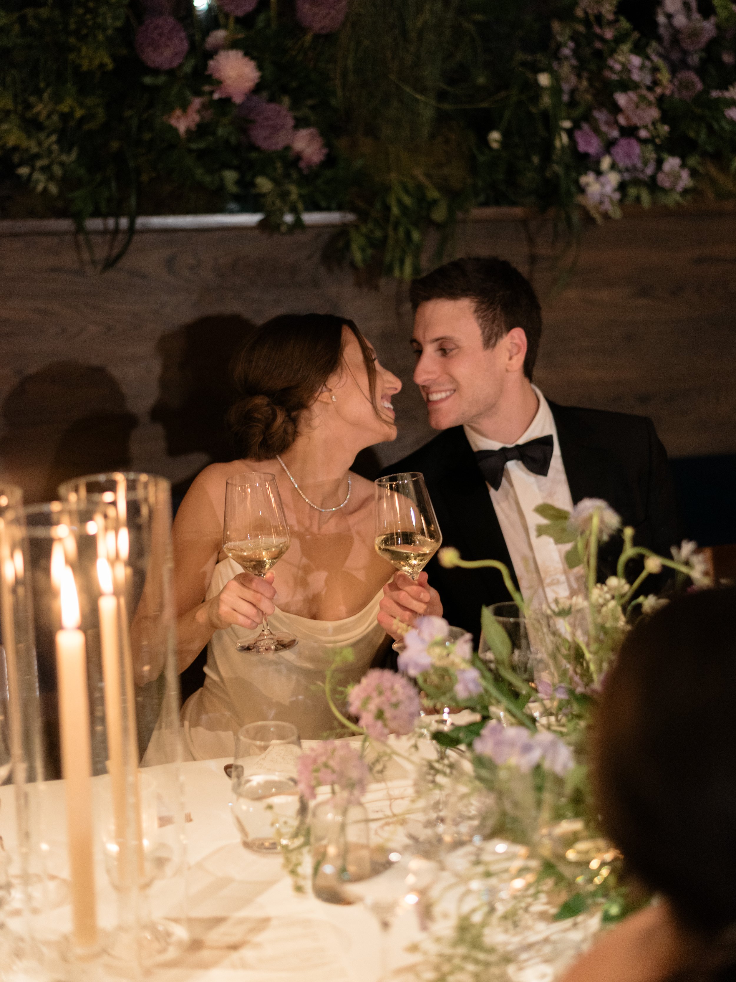 Jennie and Will share a quiet moment together at the candlelit dinner table.