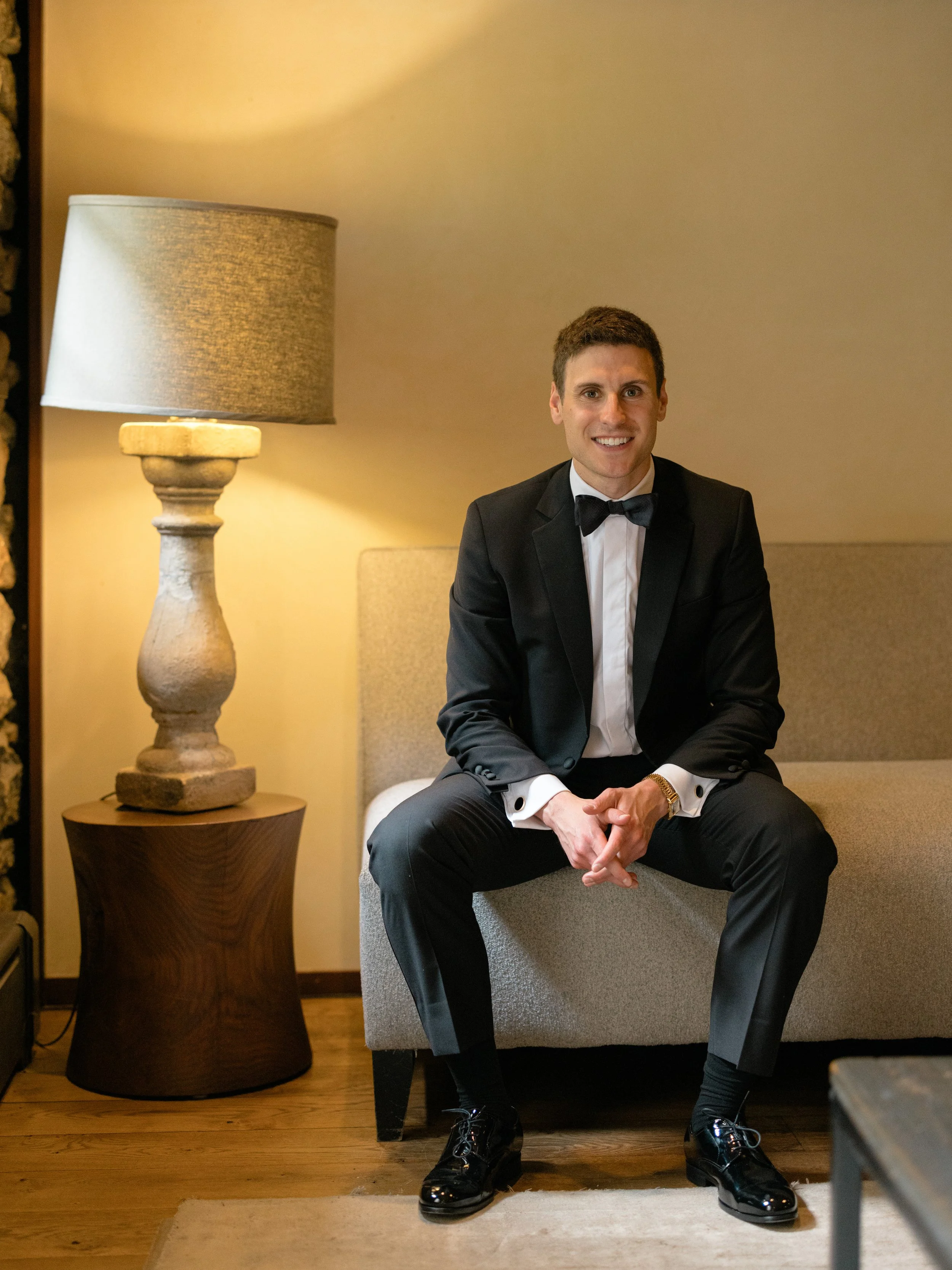 Groom preparing for his wedding day at Blue Hill at Stone Barns in New York.