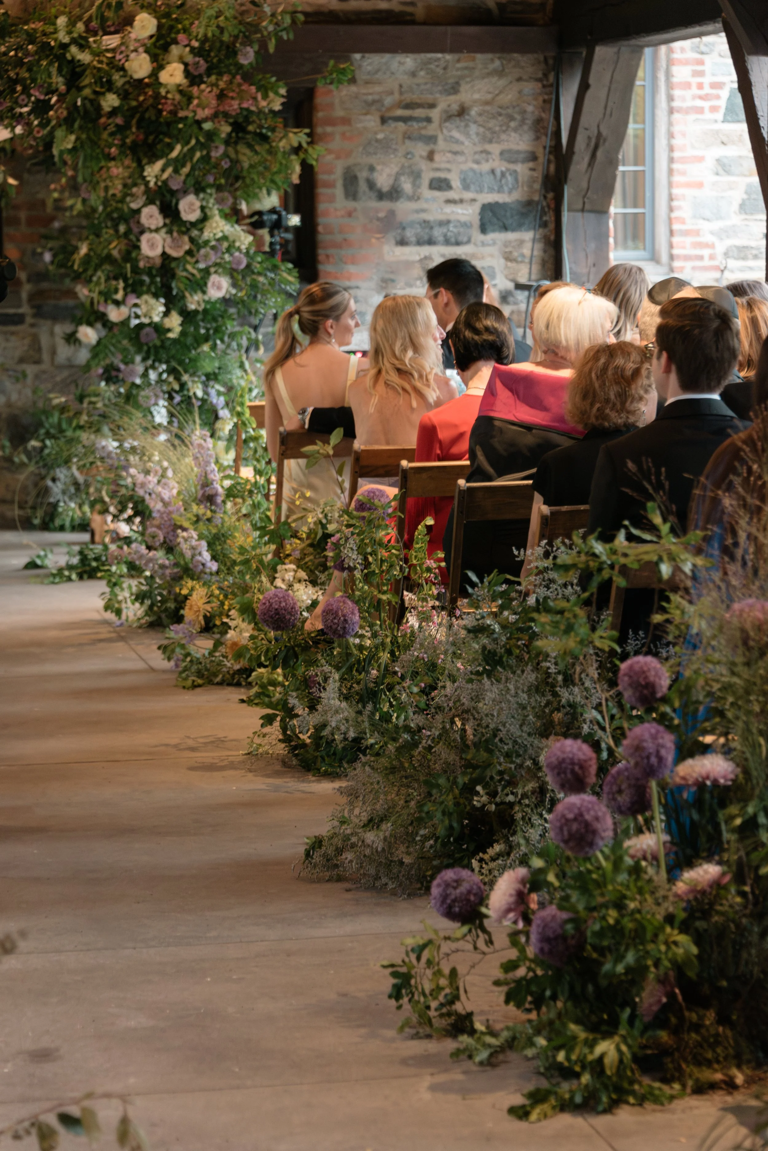Garden ceremony setting at Blue Hill at Stone Barns featuring organic floral design by Mudari Creative and Wild and Birch.