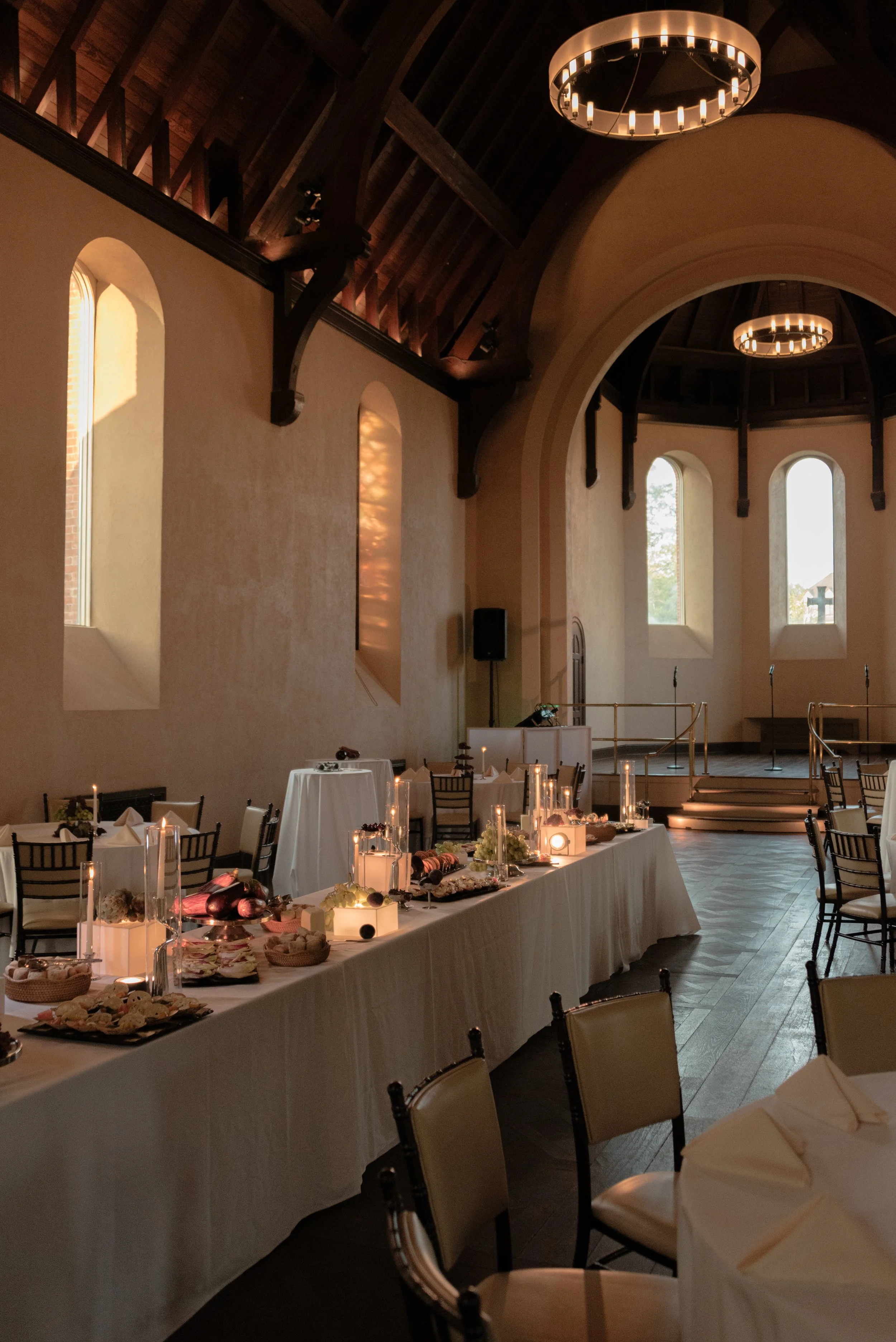 Long dining table set for Jennie and Will’s rehearsal dinner inside The Abbey Inn & Spa.