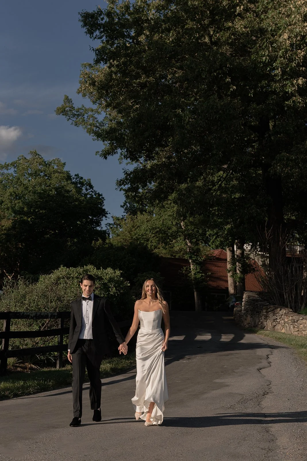 Bride and groom prepare to make their entrance to the reception in the Hay Field at Goodstone Inn
