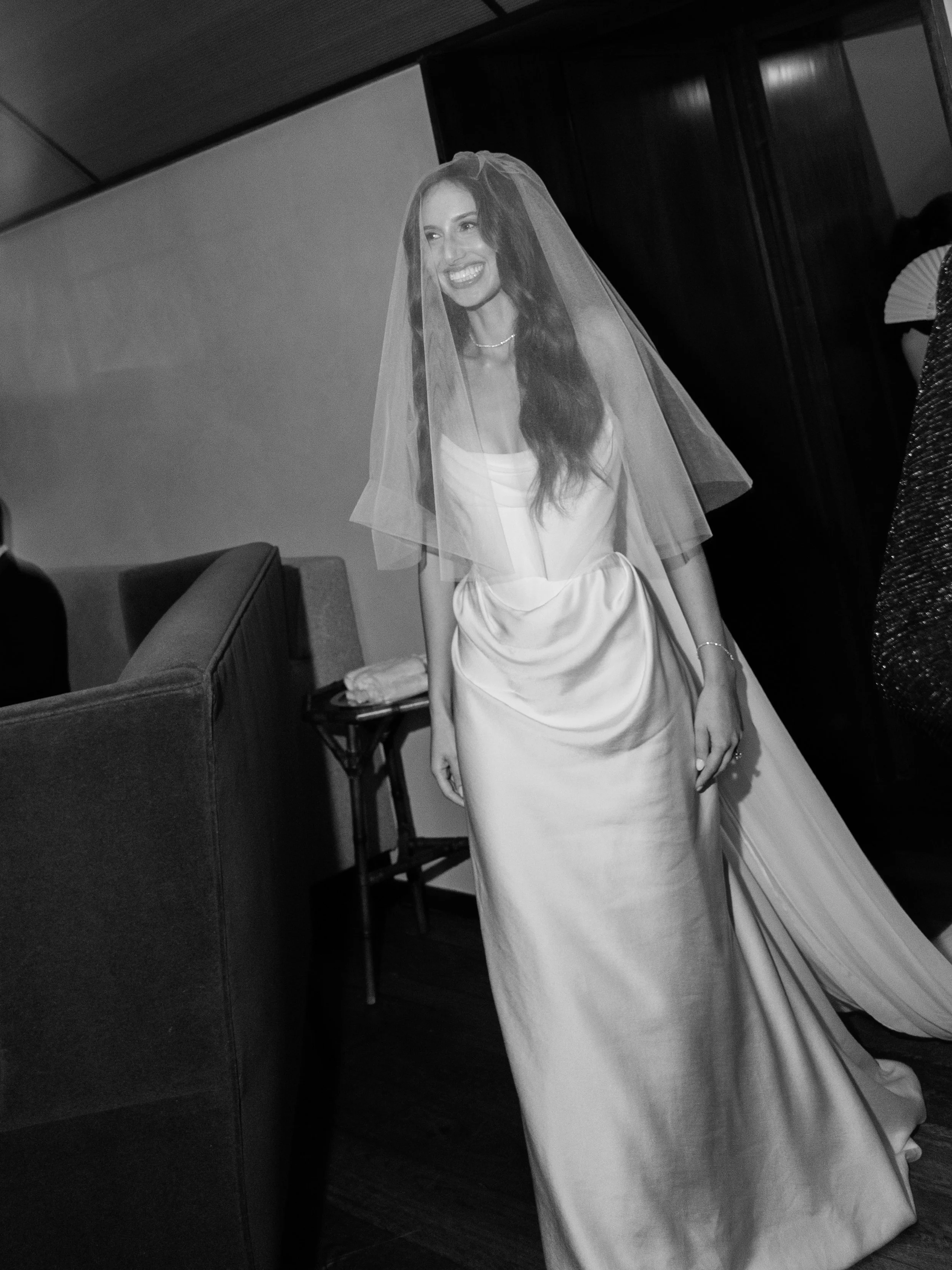 The bride enters the Ketubah ceremony wearing a blusher veil 