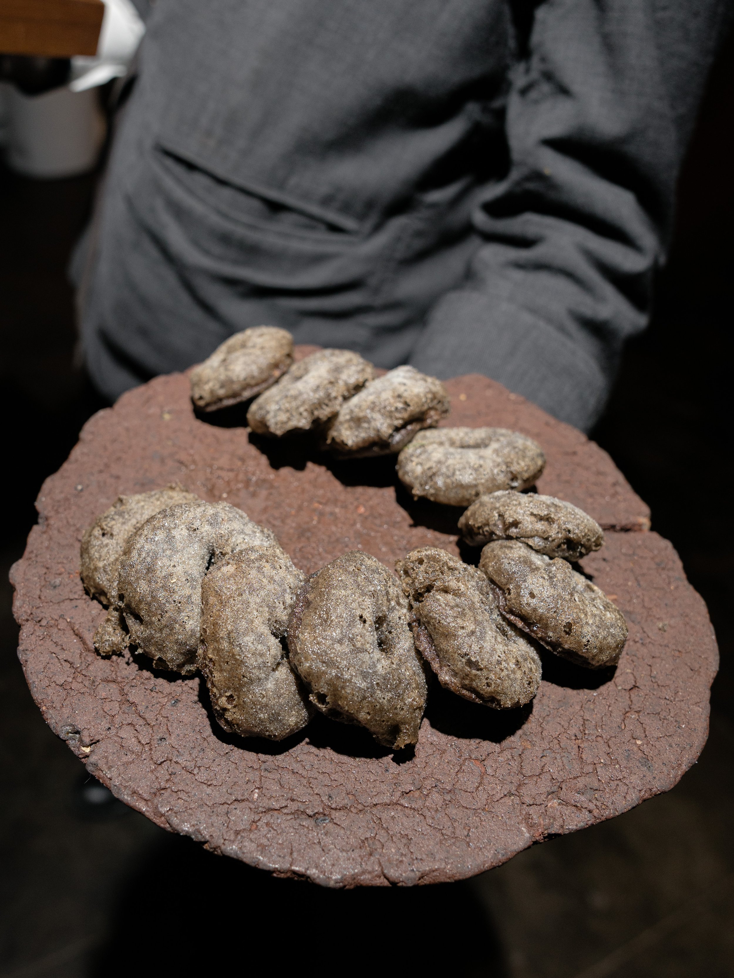 Blue Hill at Stone Barns' famous fresh baked bread served on a beautiful rustic stone serving tray as passed appetizers. 