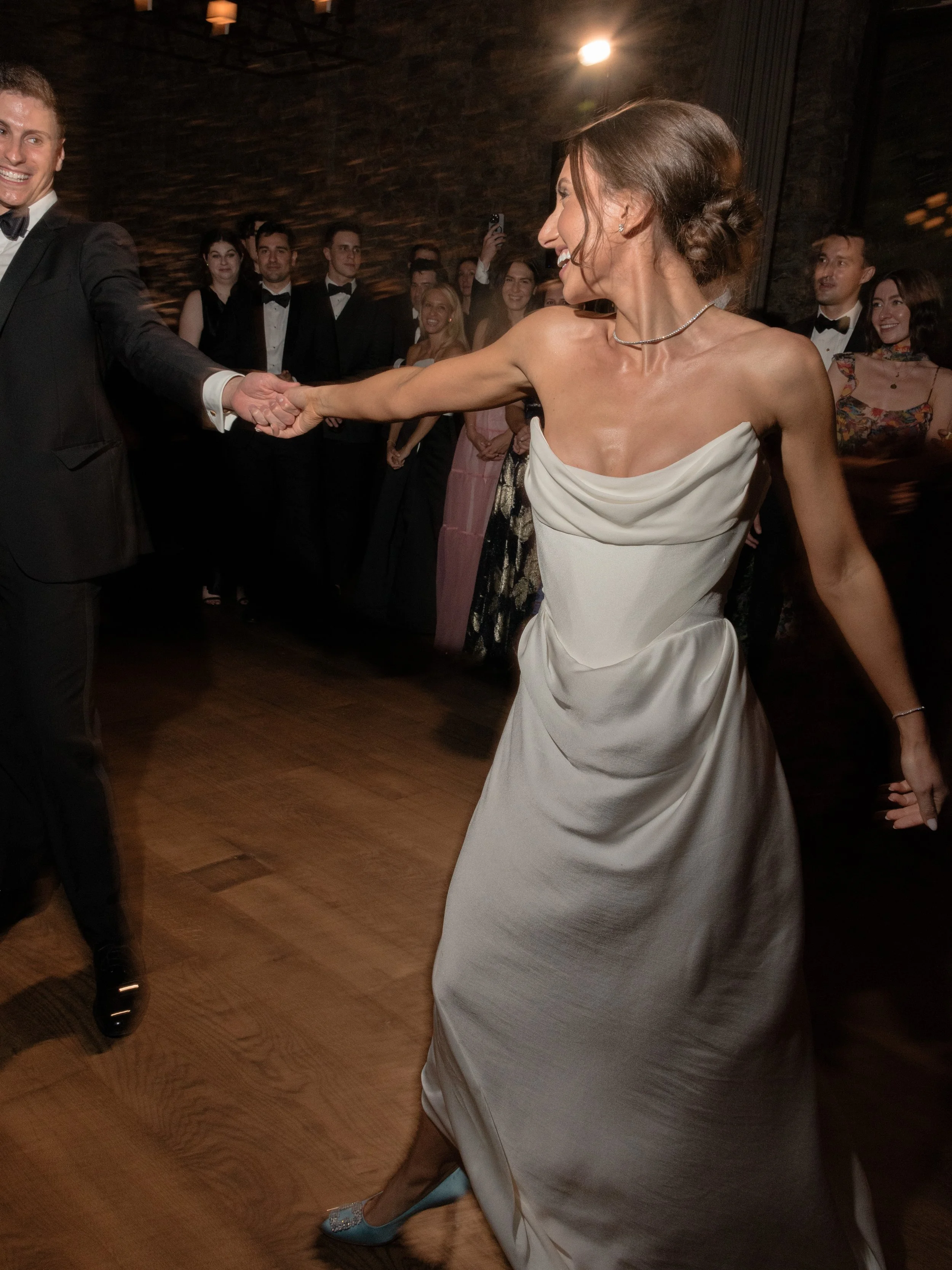Jennie dancing during the evening reception in her Vivienne Westwood wedding gown.