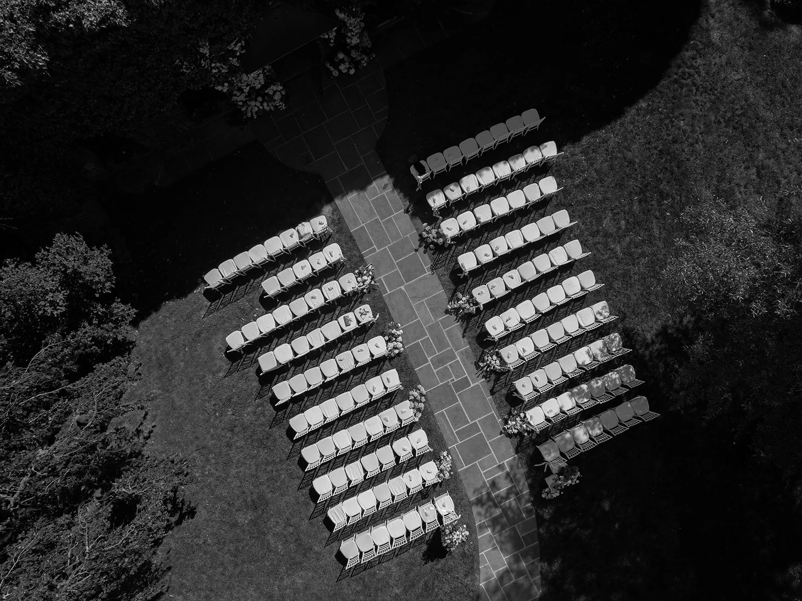 Black-and-white aerial photograph of the outdoor Ivy Wall ceremony seating at Goodstone Inn.
