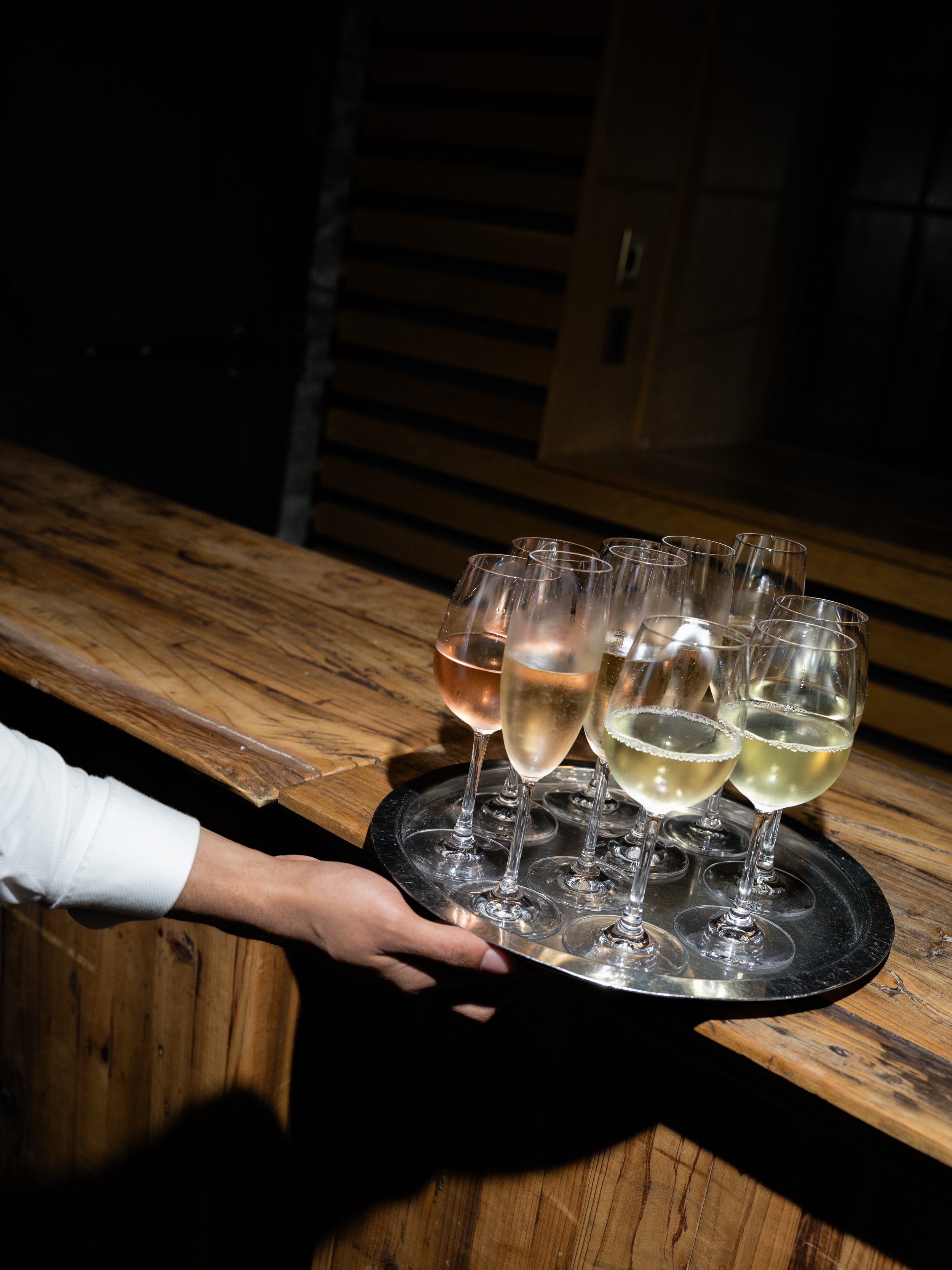 Tray of sparkling wine carried into Jennie and Will’s wedding reception at Blue Hill at Stone Barns.