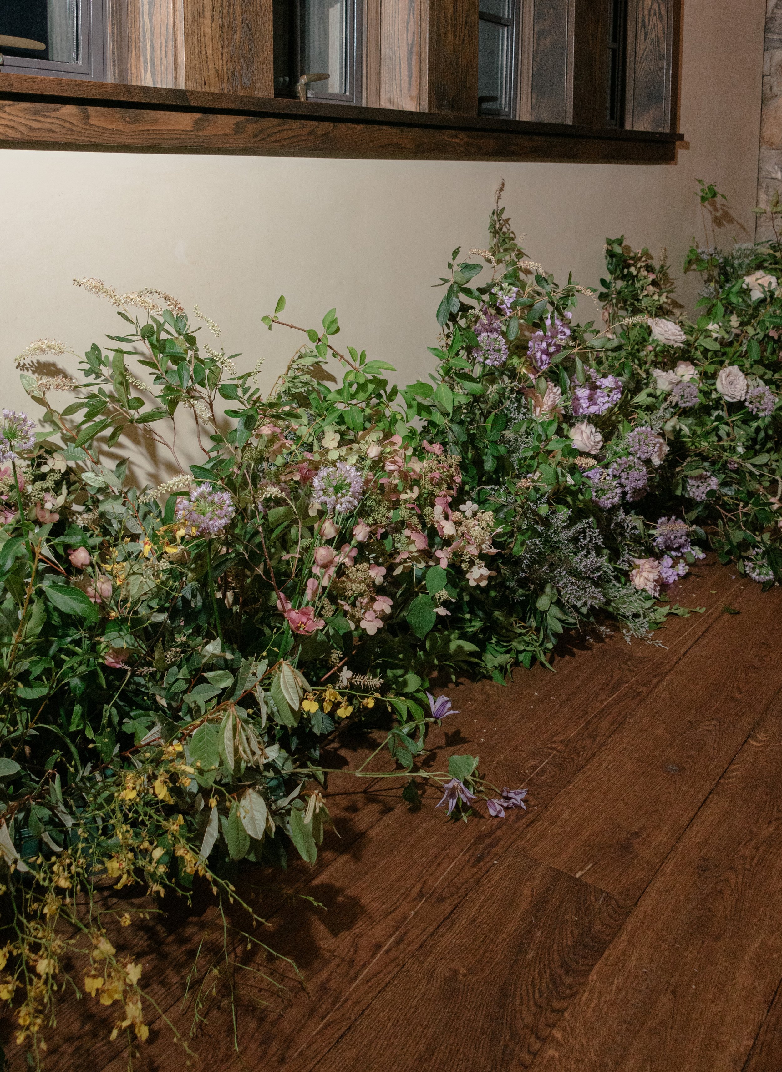 Organic floral installation lining the hallway at Blue Hill at Stone Barns, designed by Mudari Creative and Wild and Birch.