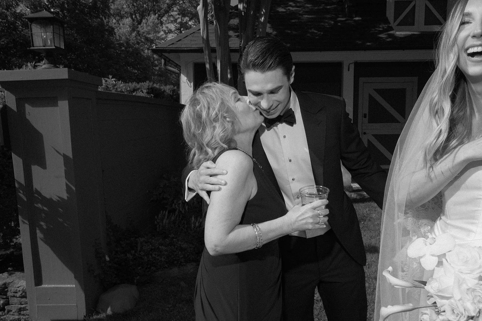 Groom and his mother share an embrace immediately after the ceremony