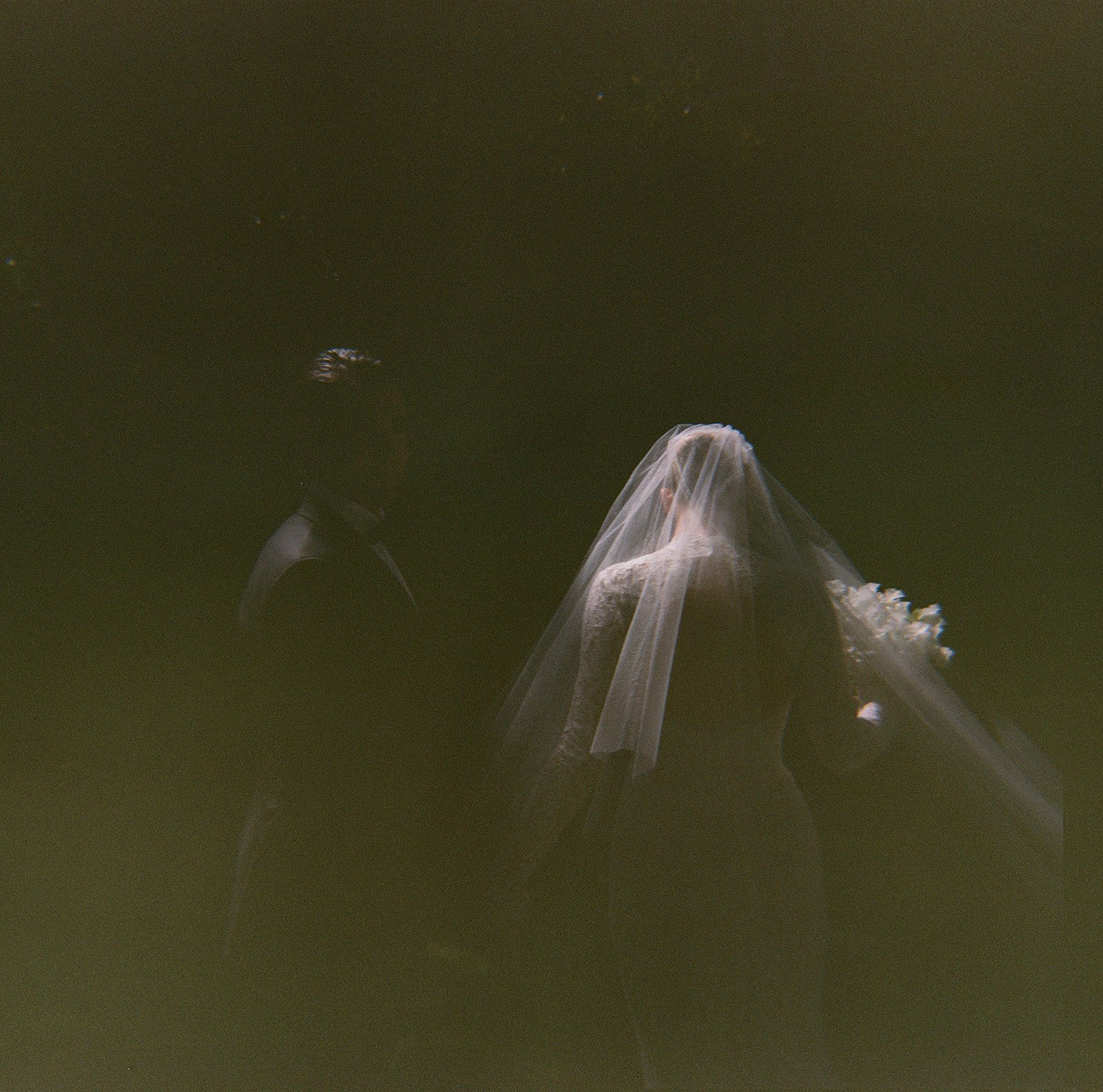 Holga film wedding photograph of a bride and groom at The High Line Hotel in Chelsea, Manhattan, captured with soft focus and grain for a dreamlike, intimate portrait.