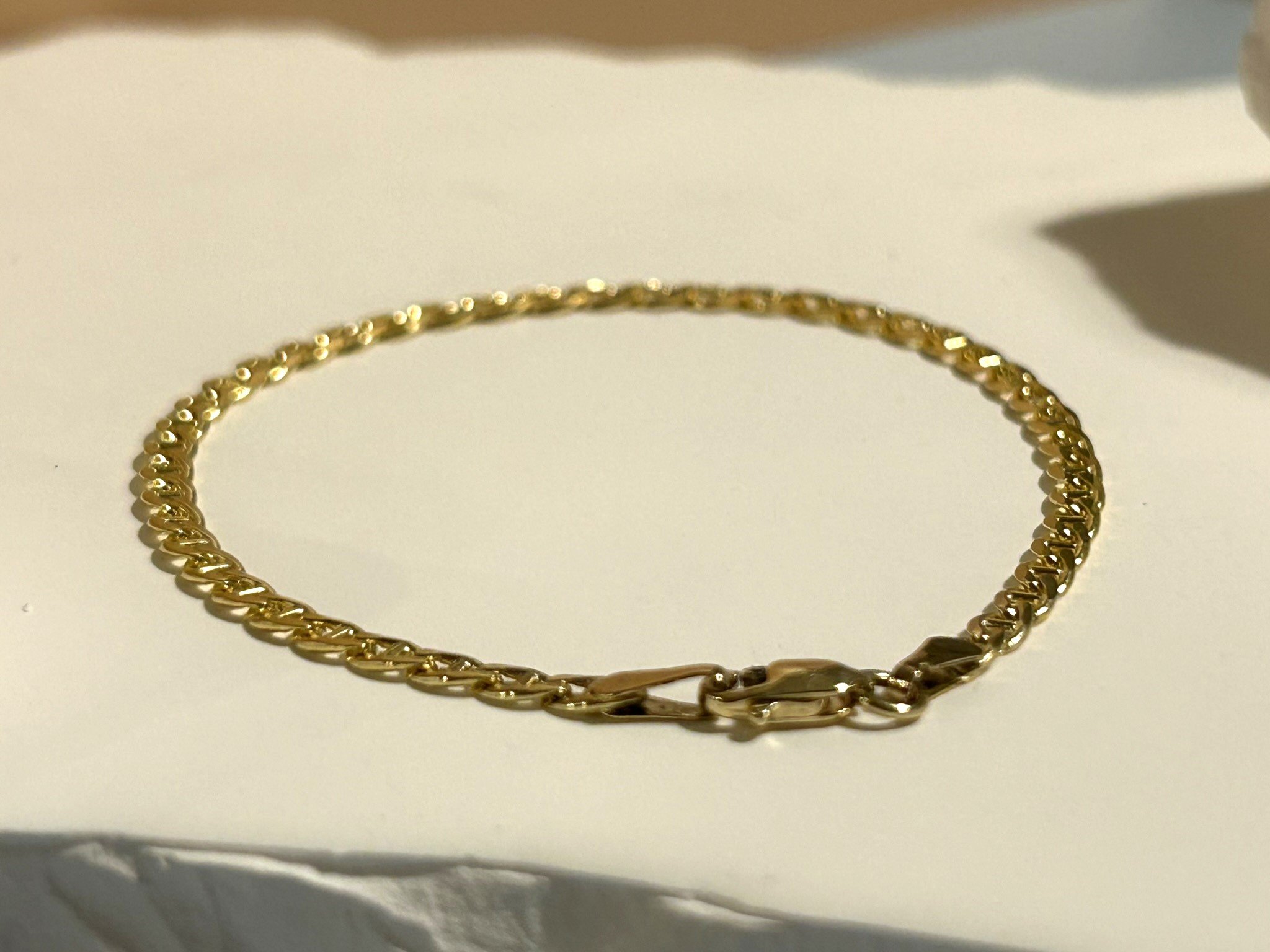 Solid 14k gold marina bracelet featuring marina curb links