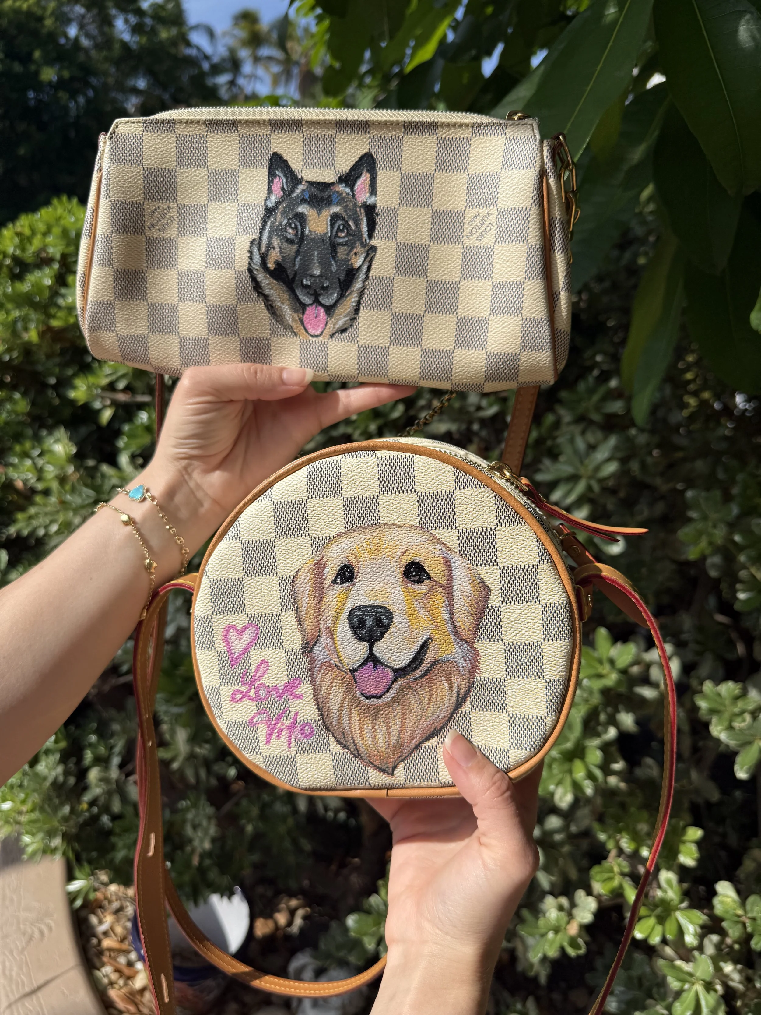 Painted pet dog portraits of a golden retriever and german shepherd on louis vuitton bags