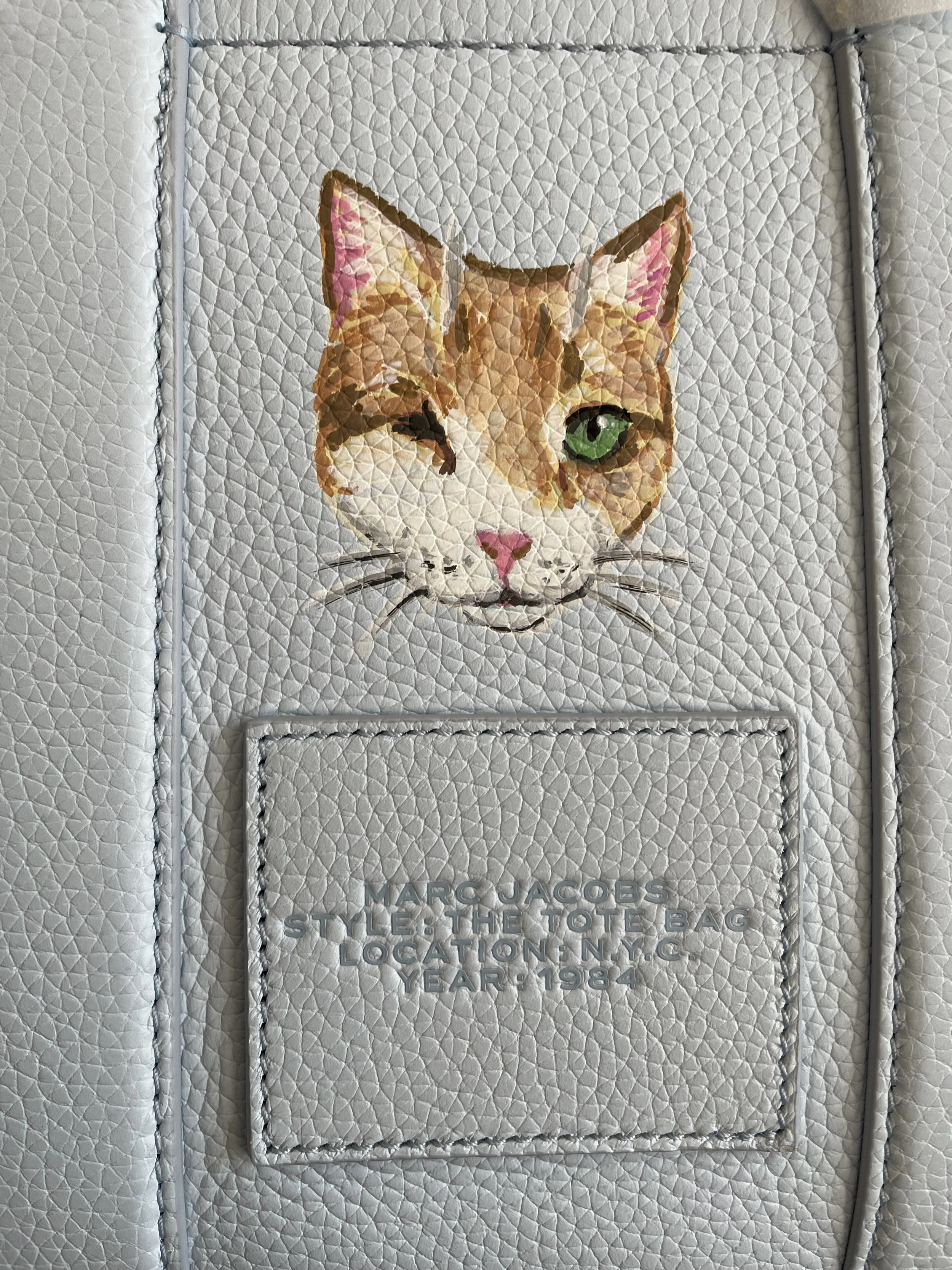 One eyed orange cat Marc Jacobs tote