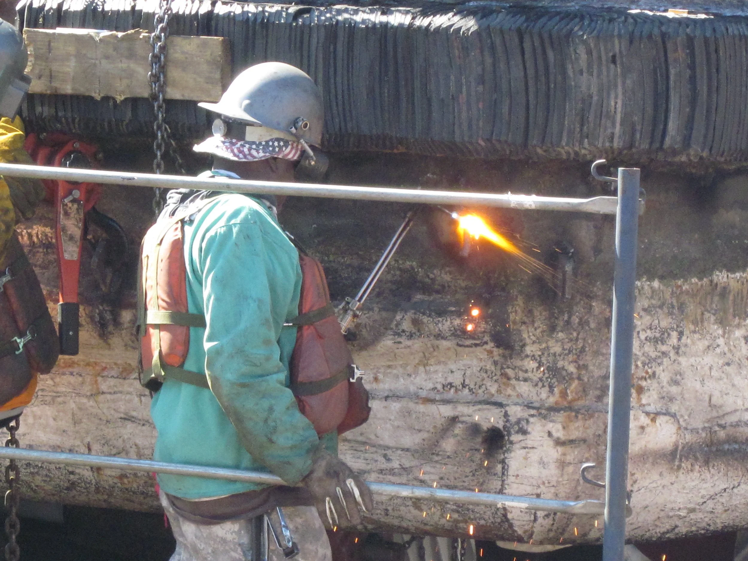 man using cutting torch