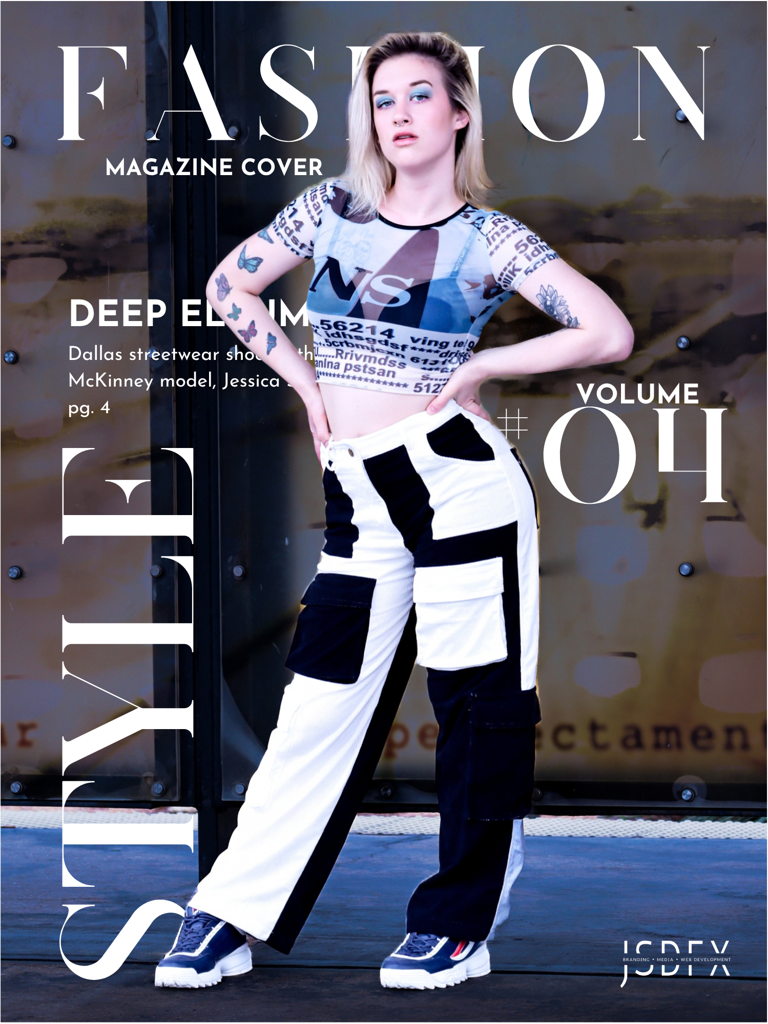 Full-body fashion portrait of a young blonde woman posing with hands on her hips in front of an urban glass panel. She is wearing a grey graphic mesh top with text prints, two-tone black and white wide-leg cargo pants, and chunky blue athletic shoes.