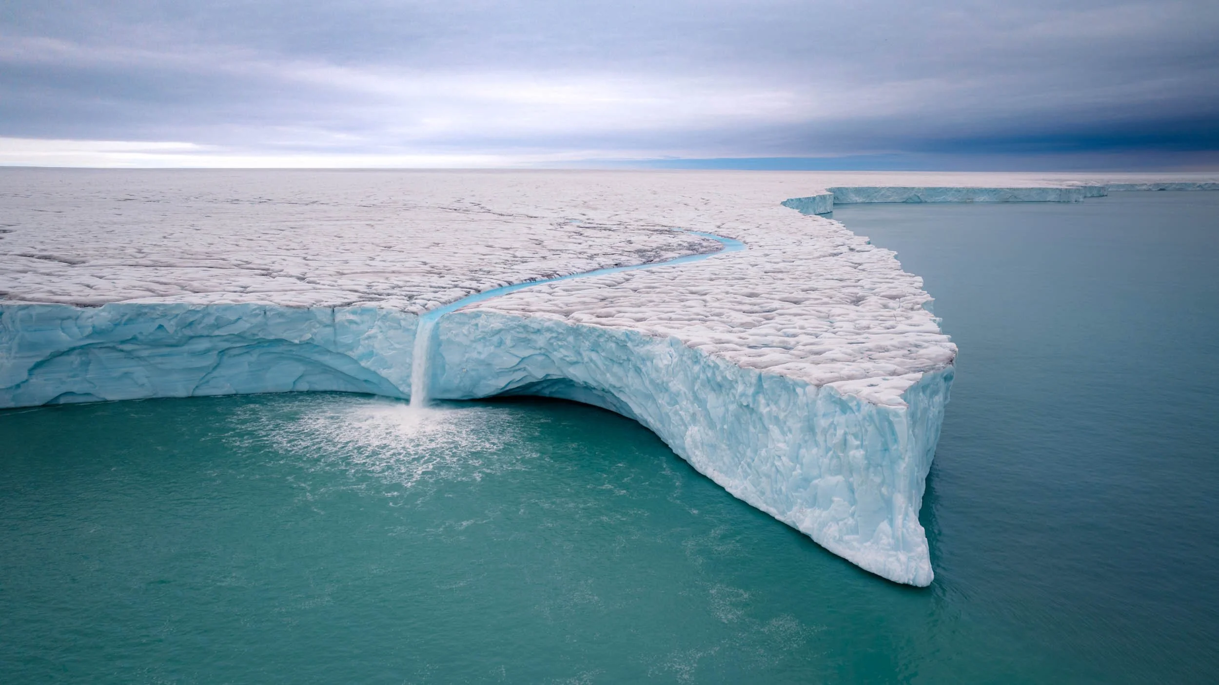 Waterfall Bråsvellbreen Svalbard shot with DJI Inspire 3