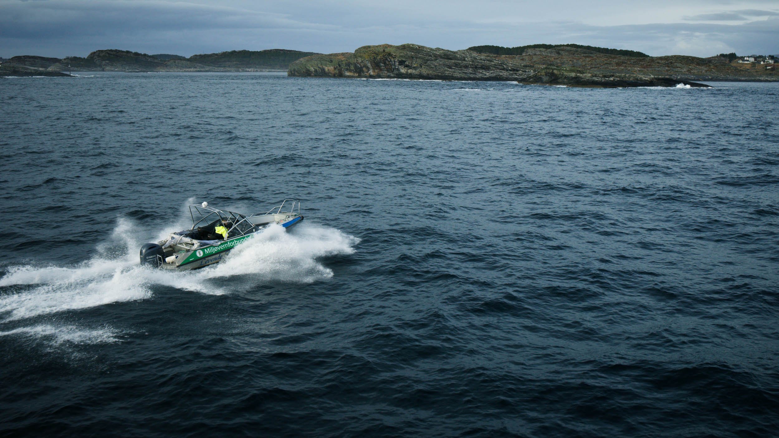 Boat in waves Øygarden Norway with drone