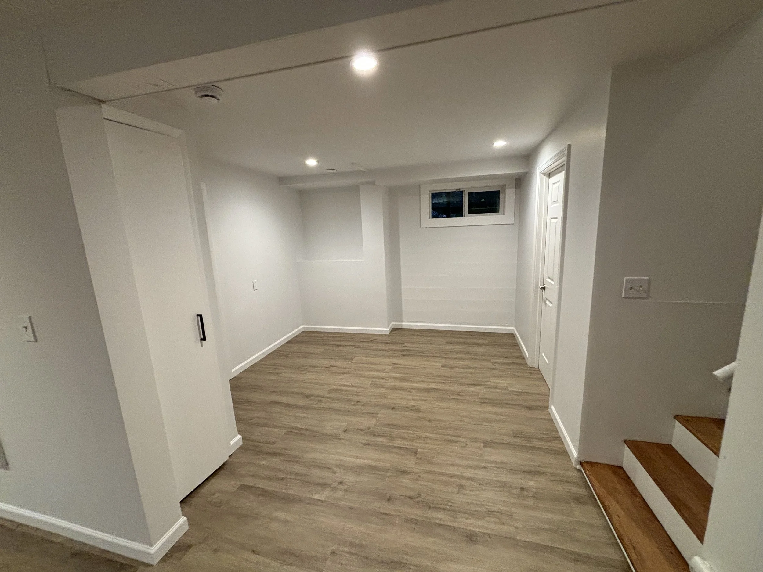 extra space with large storage and utility sink to the right