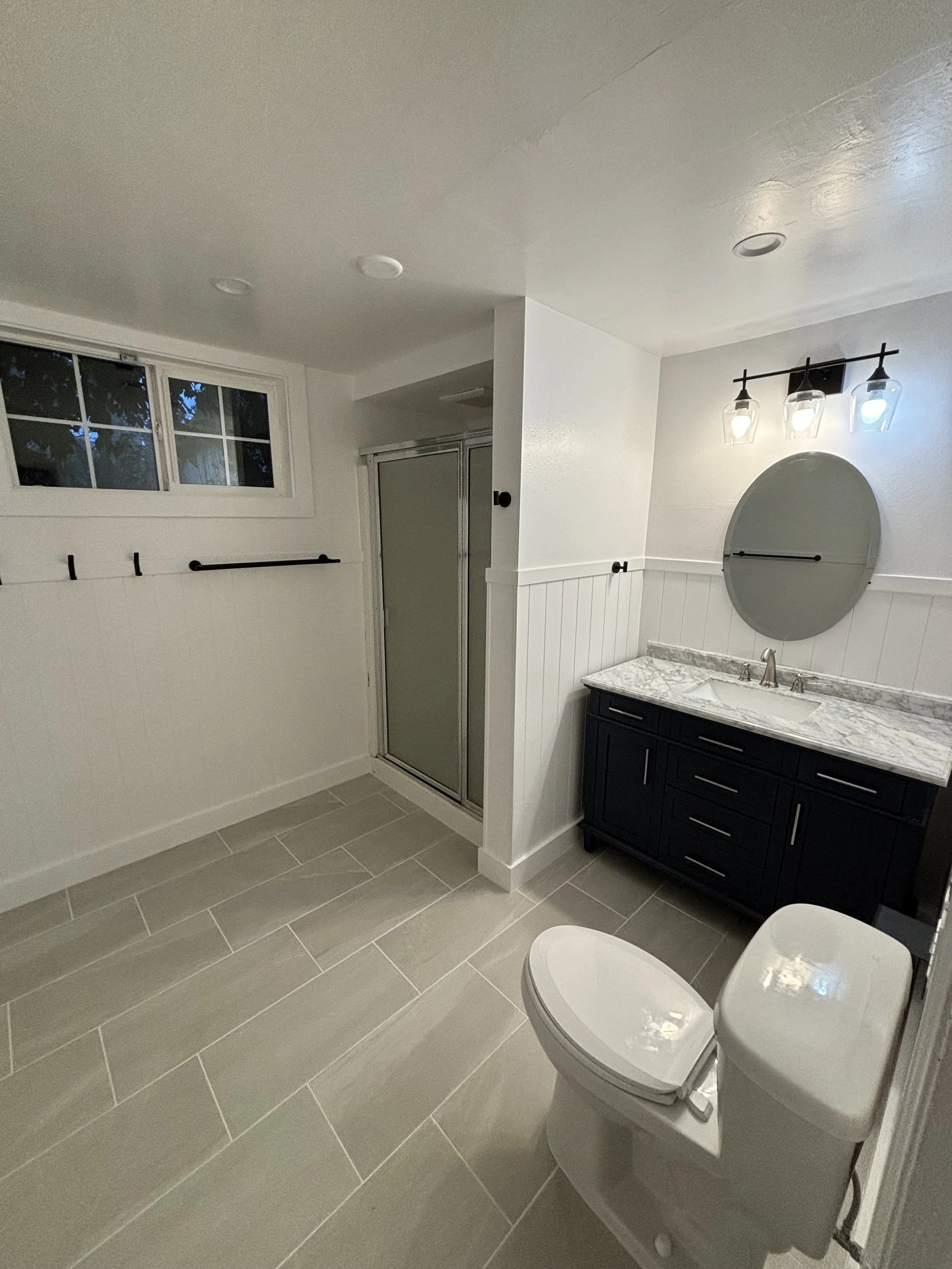 remodeled primary bathroom with heated floors