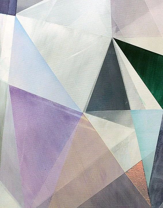 Close-up of a colorful geometric mural with various triangles in shades of white, purple, green, blue, and black.