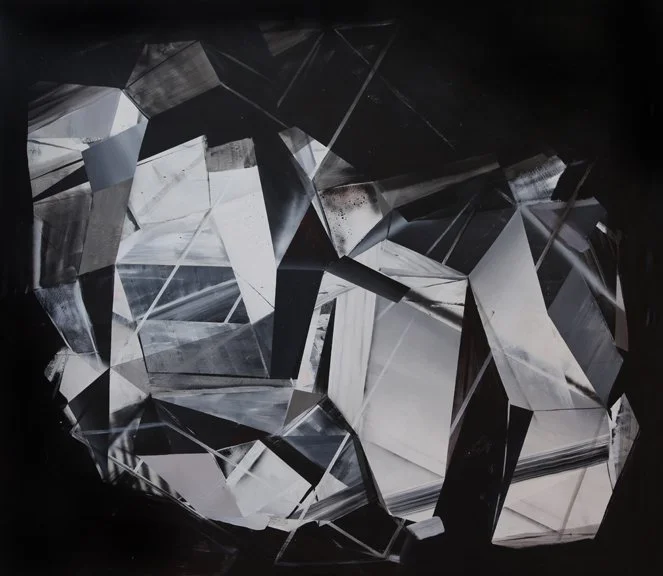 Close-up view of a collection of large, irregularly shaped diamonds with a reflective, shiny surface.