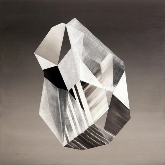 Black and white abstract geometric crystal-like shape with sharp edges and facets.