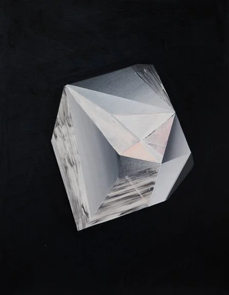 A silver, faceted geometric object resembling a gemstone set against a black background.