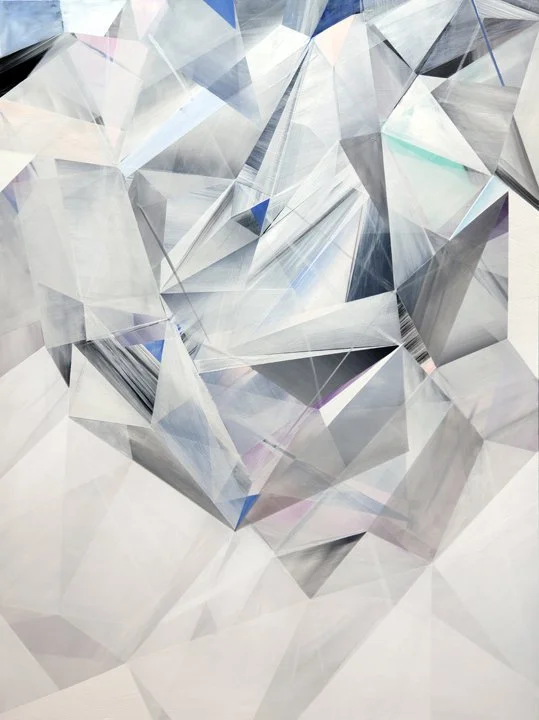 Close-up of a shiny, faceted diamond with a reflective surface.