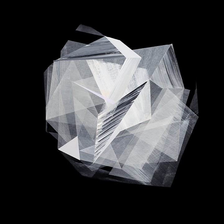 Abstract geometric sculpture made of transparent and reflective acrylic panels on a black background.