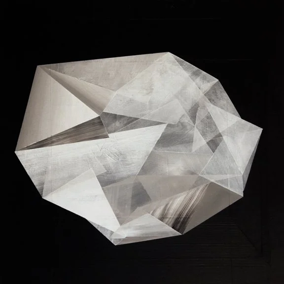 A geometric sculpture with sharp edges and facets, made of reflective material, positioned against a black background.