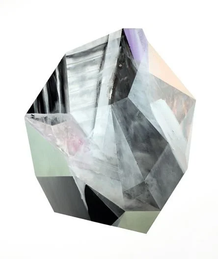 A transparent, faceted gemstone, resembling a diamond or crystal, with a geometric shape and multiple reflective surfaces.