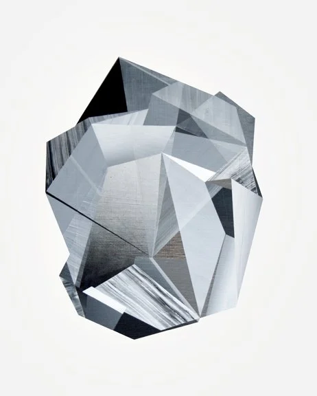 A geometric 3D crystal with multiple facets and reflective surfaces against a plain white background.