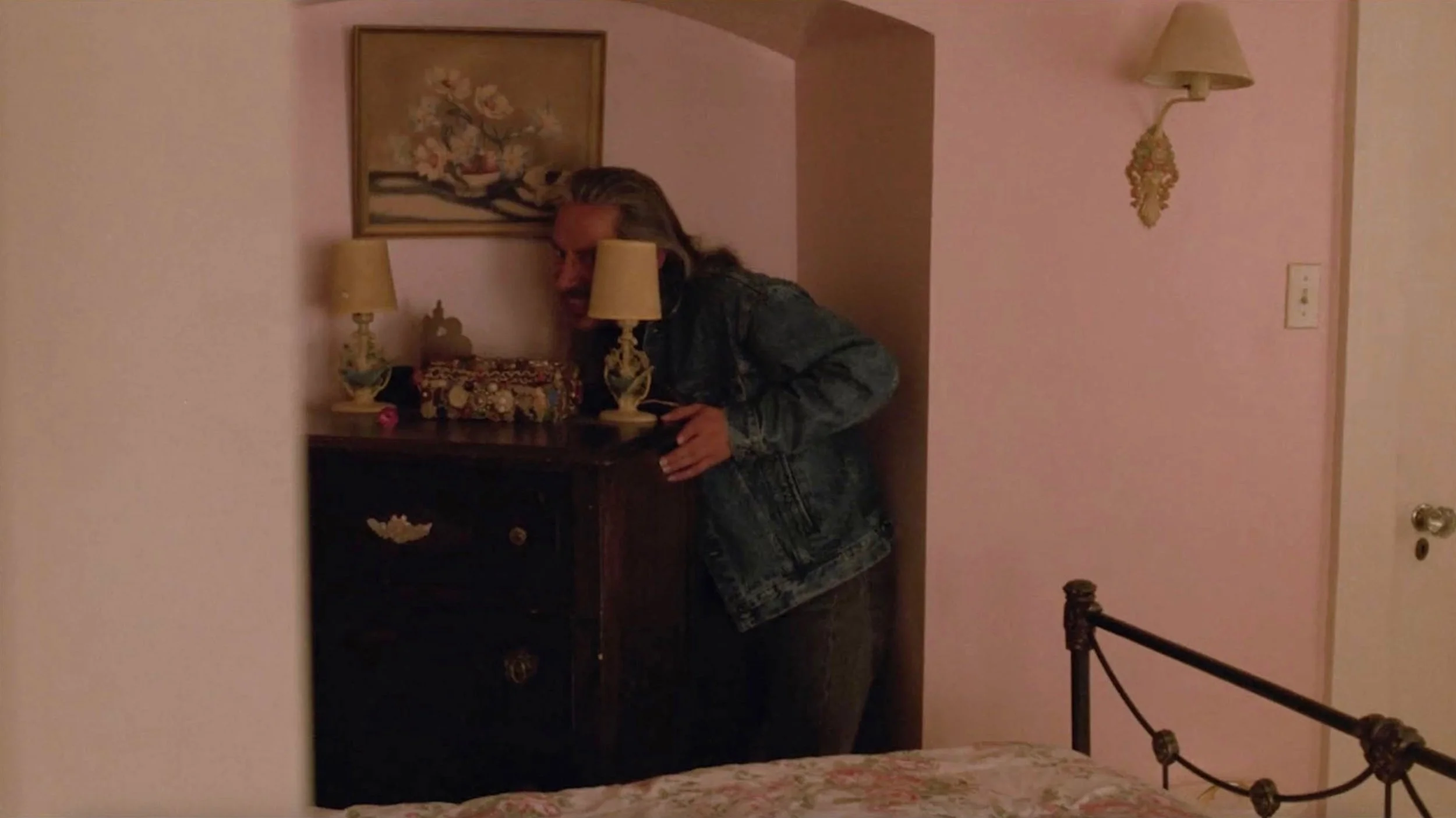 still shot from "Twin Peaks" tv show with Killer BOB behind dresser in pink room
