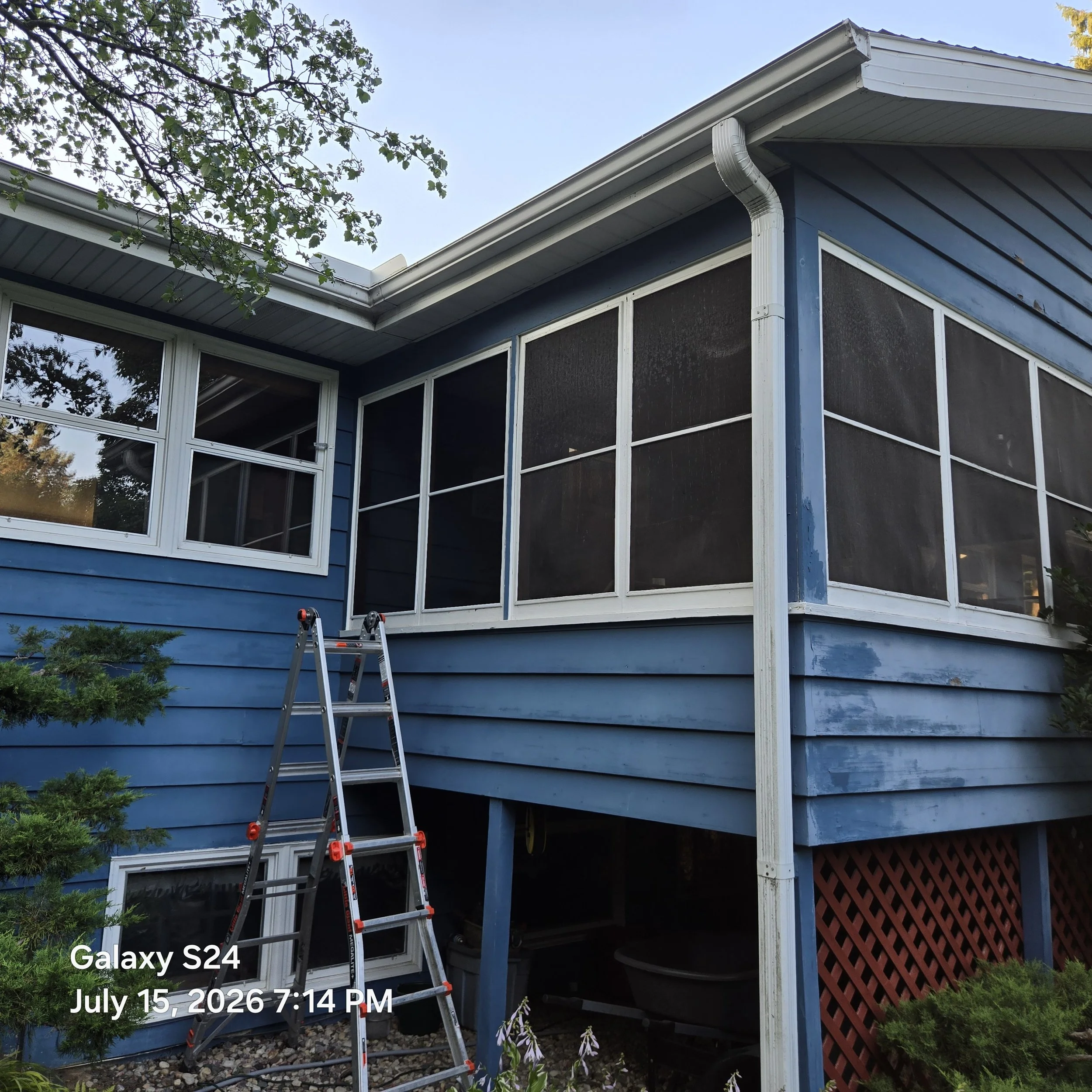 In process porch re-screening. Can you tell which window screens have been replaced?