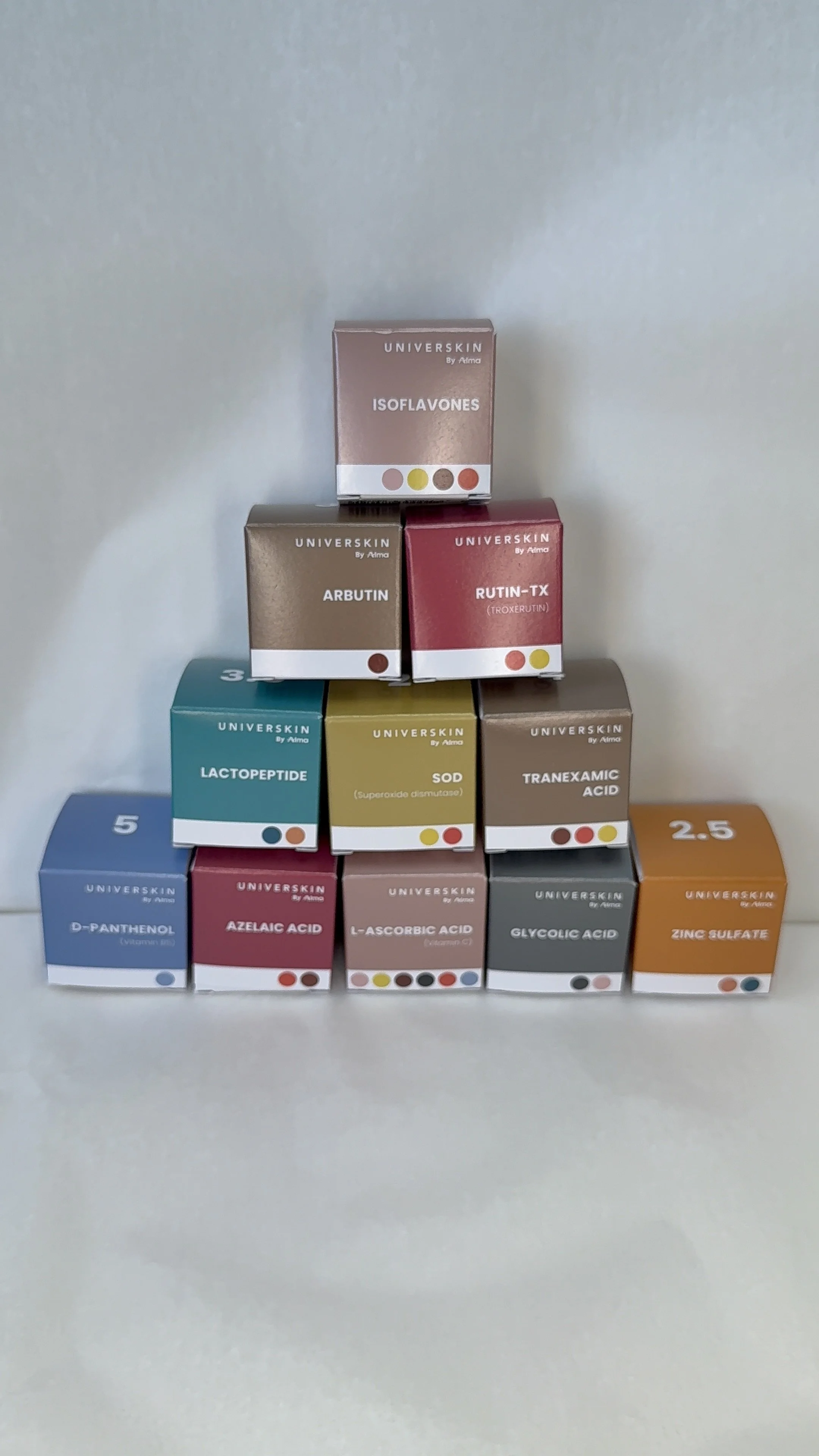 A stack of skincare ingredients of various colors, skincare ingredients that go into the customizable serum.