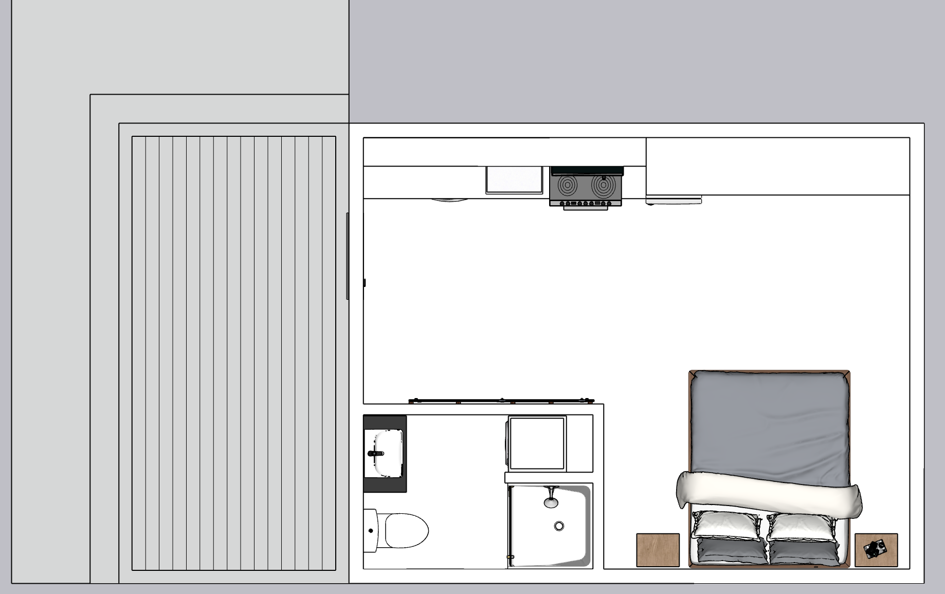 Top-down view of a small studio apartment layout showing a bed, a nightstand with a phone, a bathroom with a toilet, sink, and shower, and a kitchenette with a stove, sink, and countertop, with a gray exterior and a deck area.