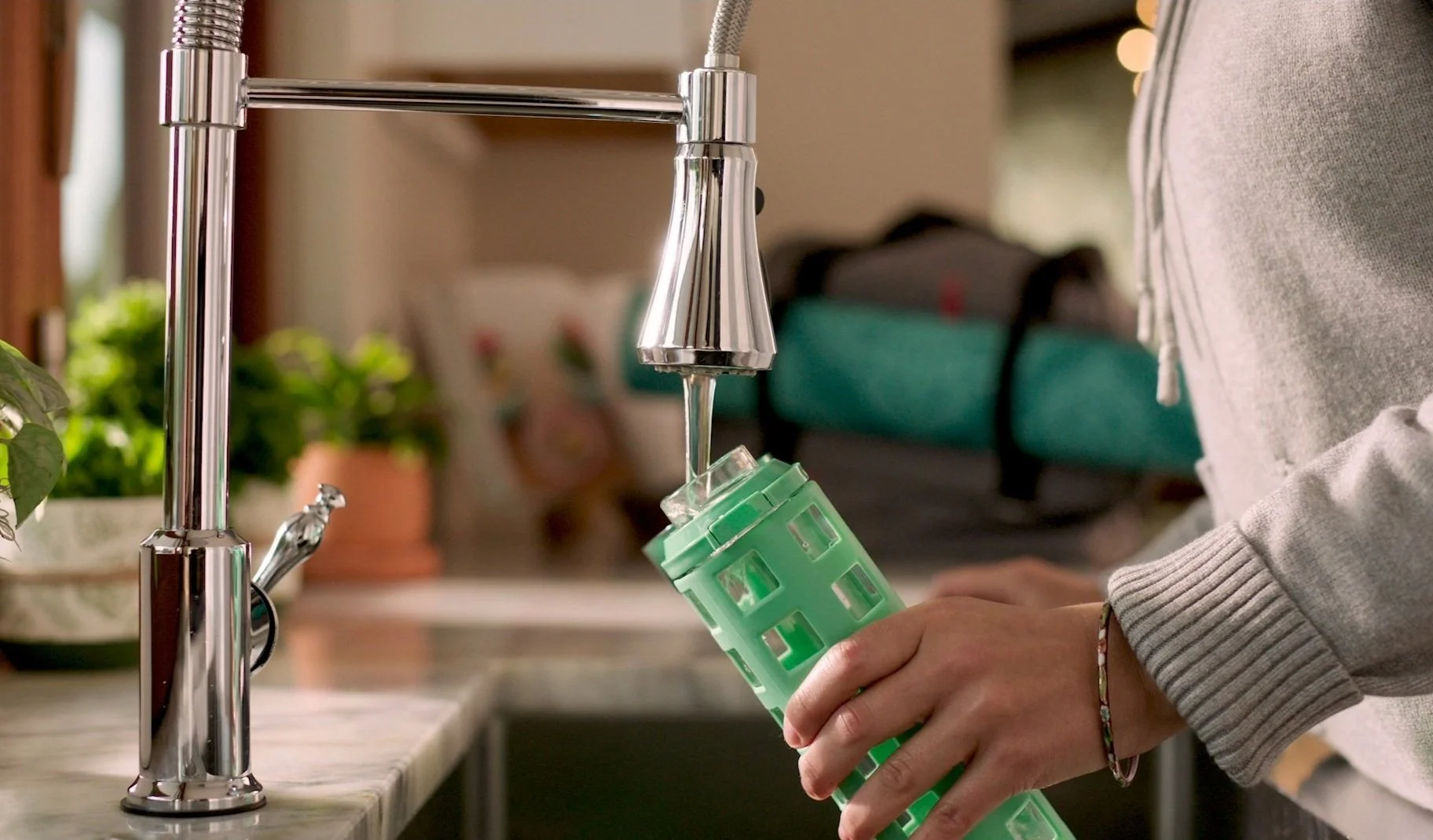 A water bottle being filled with water