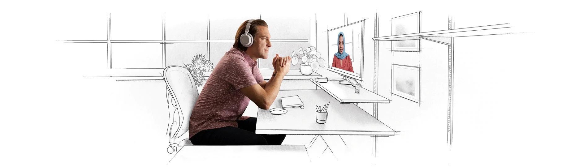A man wearing headphones and sitting at a table