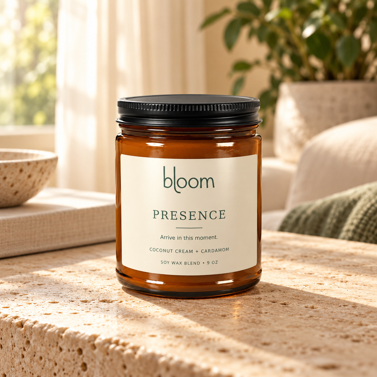 Bloom Presence 9 oz Coconut Cream and Cardamom candle styled on a table in a home setting.