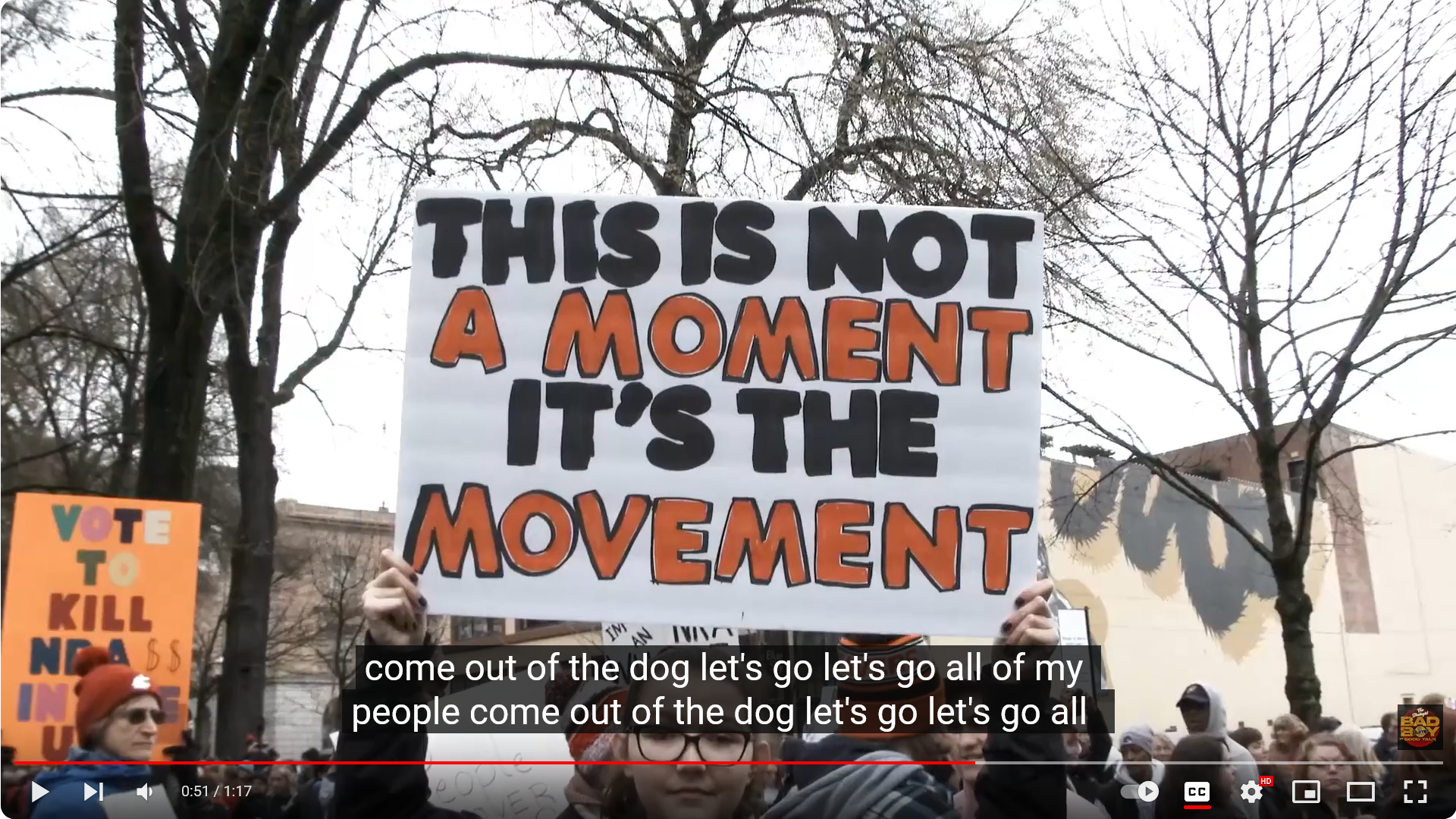 Protest sign reading 'This Is Not a Moment It's the Movement'