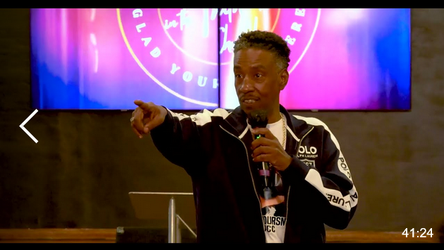 Darrell Jones speaking to youth in church
