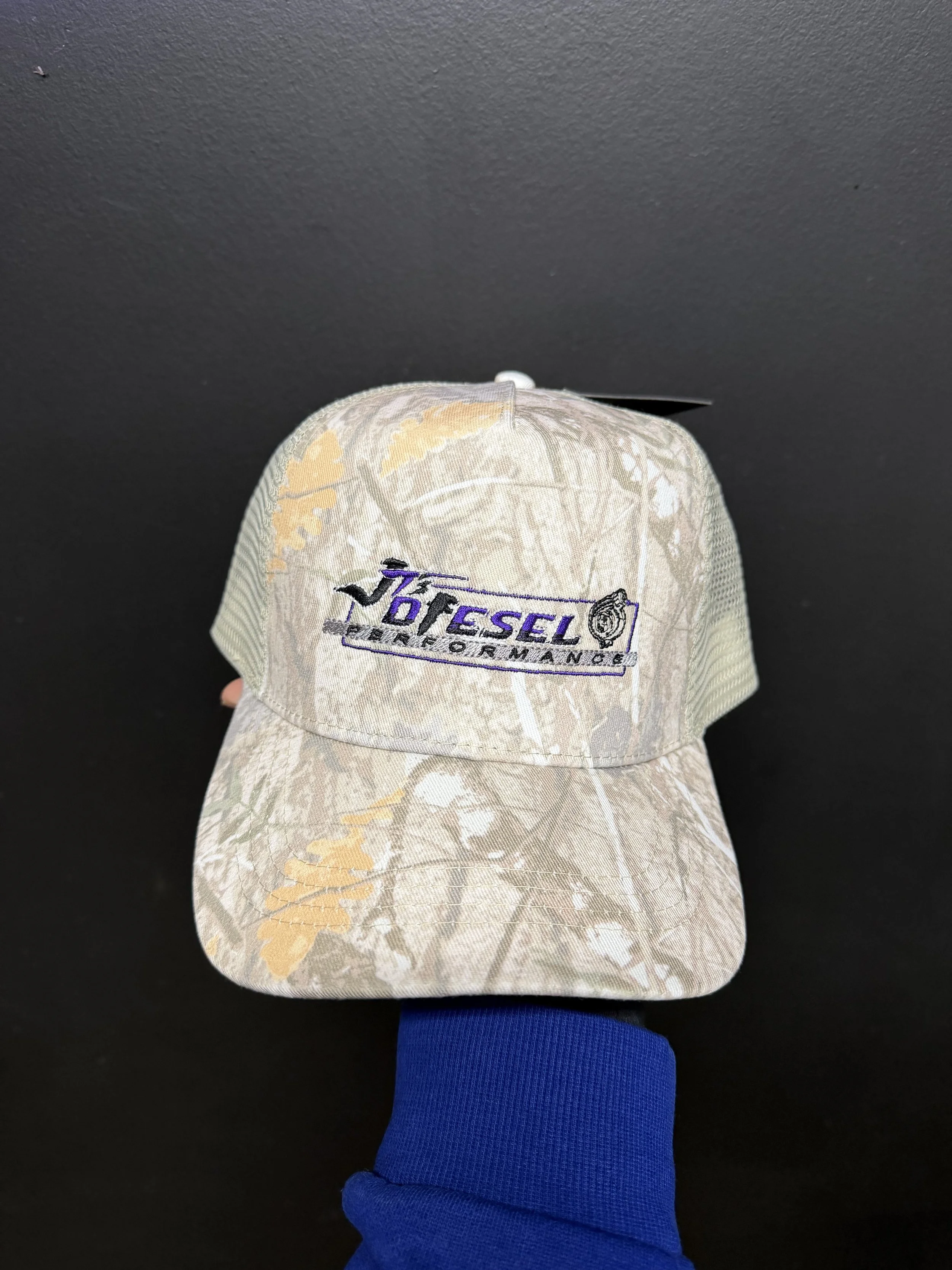 Camo trucker style hat with logo