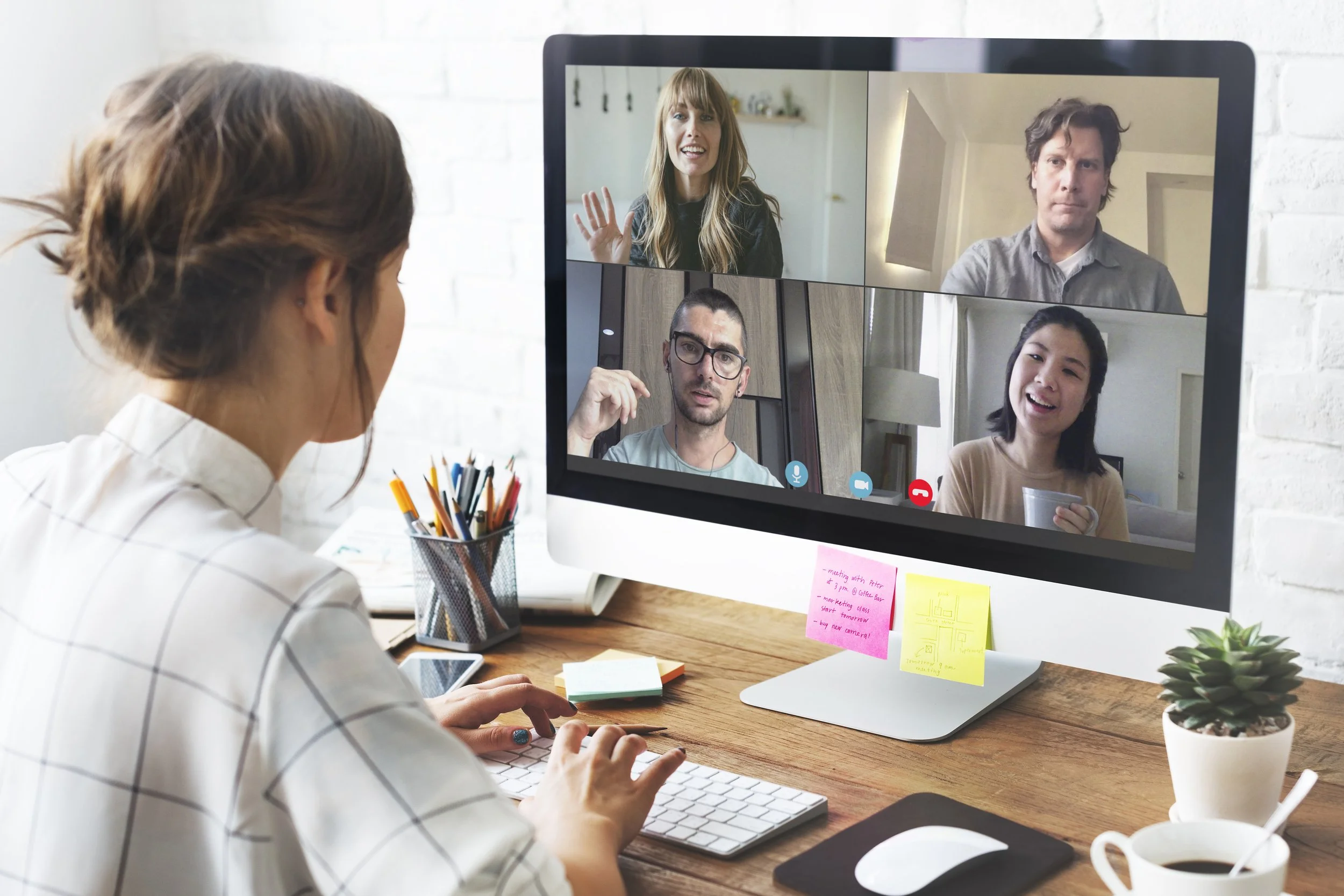 A therapist leading a secure virtual group therapy session across New Jersey with multiple participants joining safely from home on a laptop.