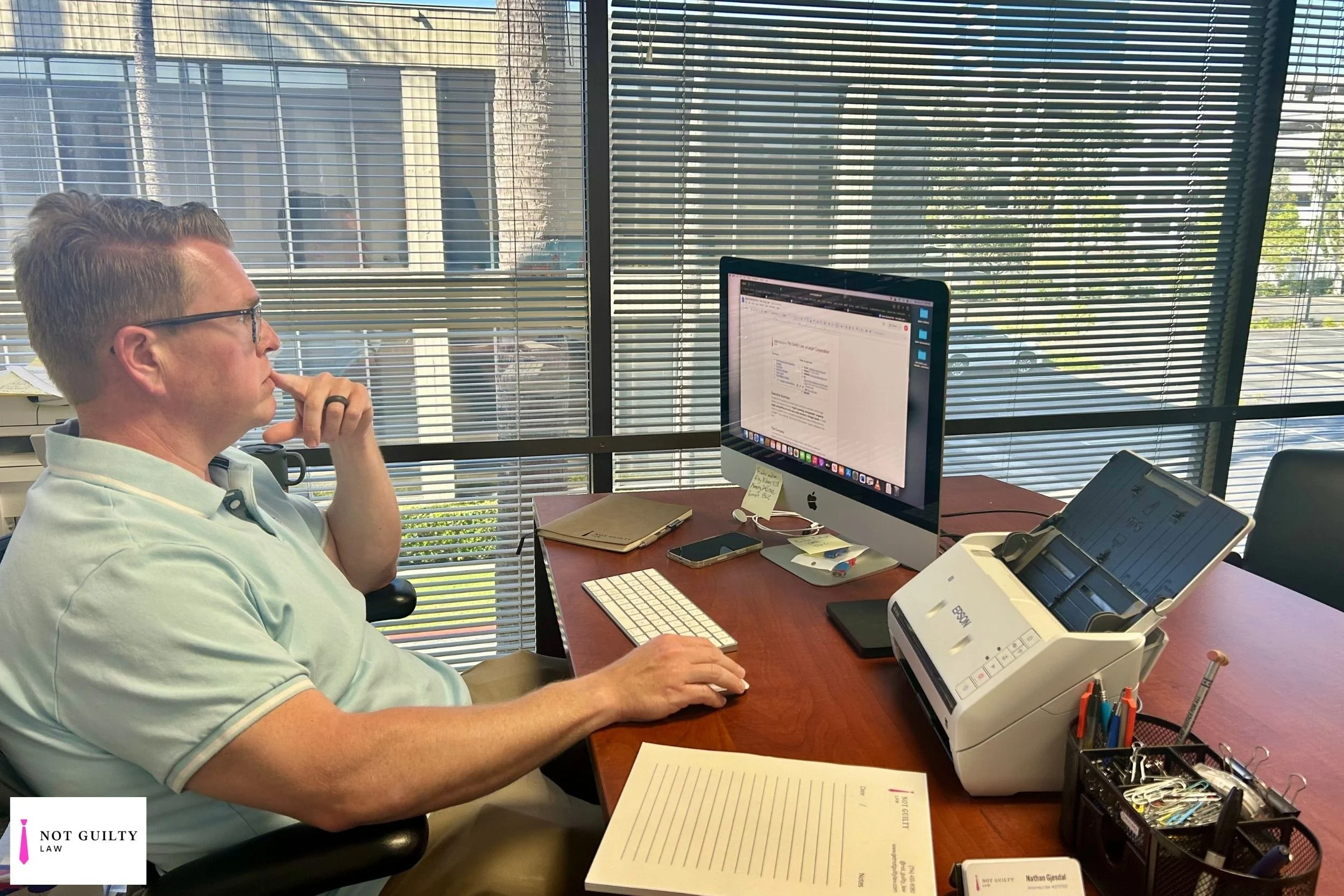 Attorney Nate Gjesdal working at a laptop, representing legal advocacy to resolve outstanding California warrants.
