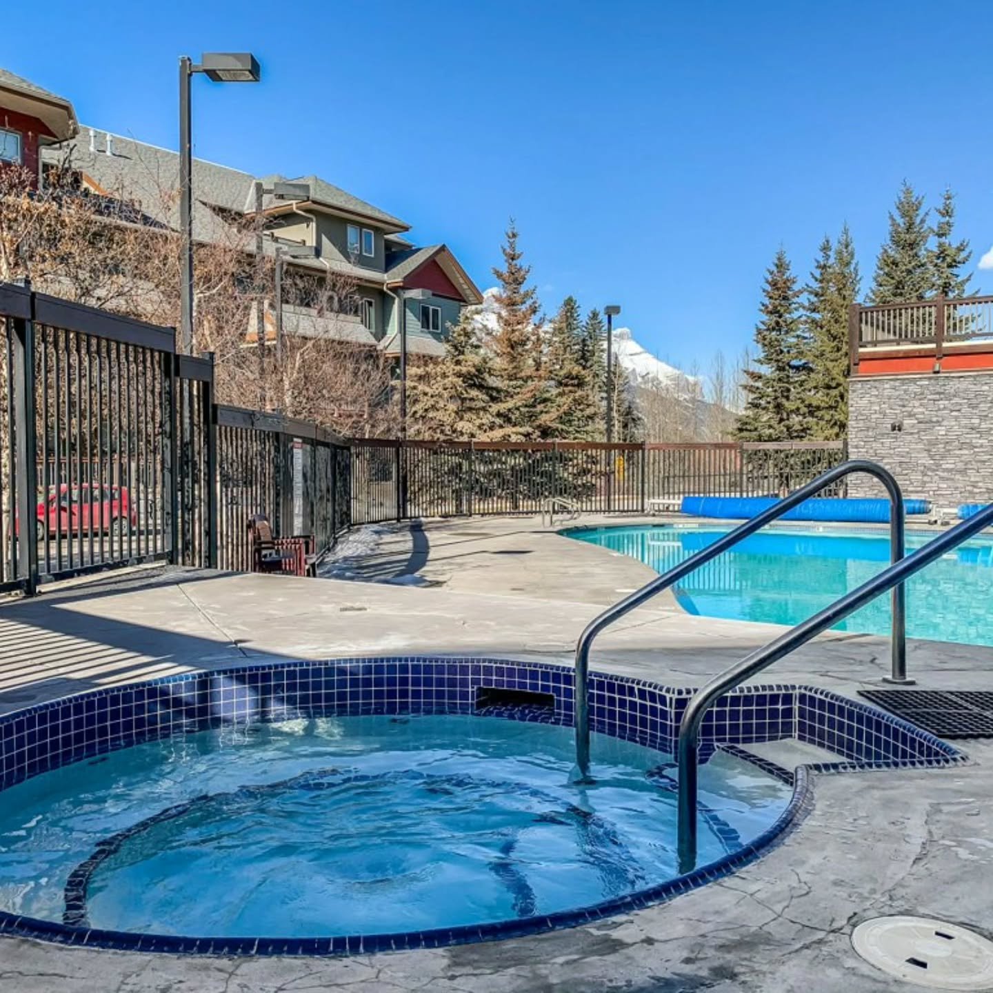 Unwind with mountain views! 🌄 Whether it's a refreshing dip in the heated pool or a soothing soak in one of the three outdoor hot tubs, relaxation is always on the agenda at our Lodges at Canmore property.

Book direct from the link in our bio and s