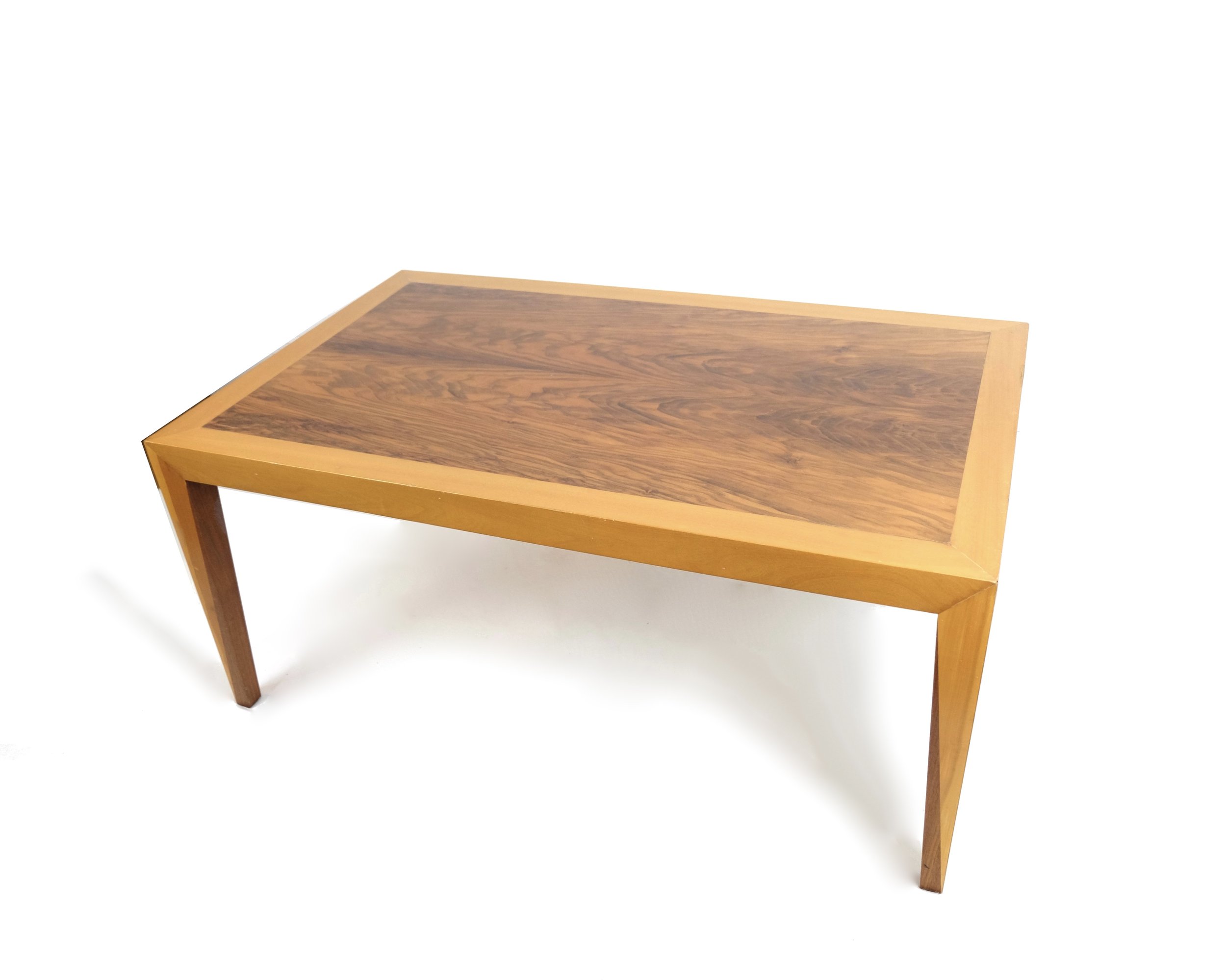 A WALNUT AND SATINWOOD COFFEE TABLE