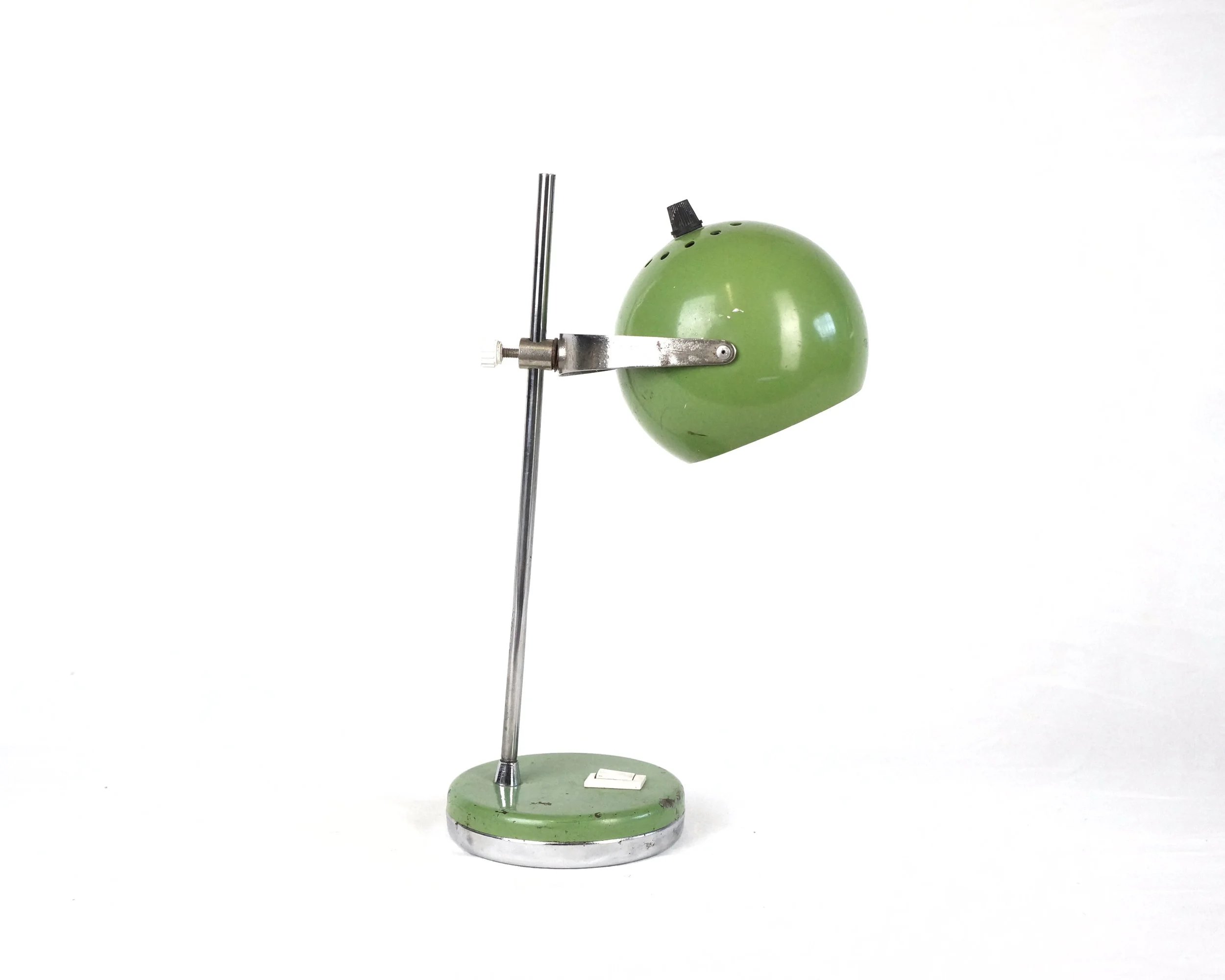 A MID-CENTURY GREEN EYEBALL LAMP