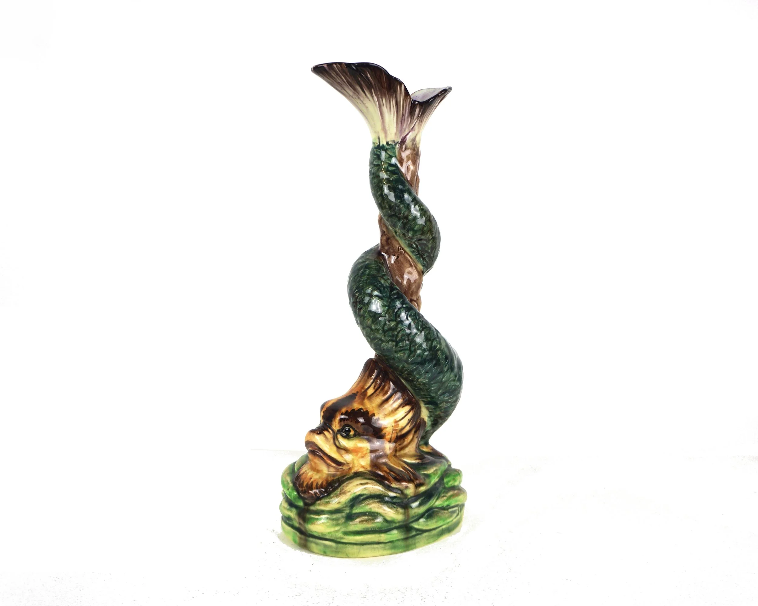 A VICTORIAN MAJOLICA DOLPHIN CANDLESTICK
