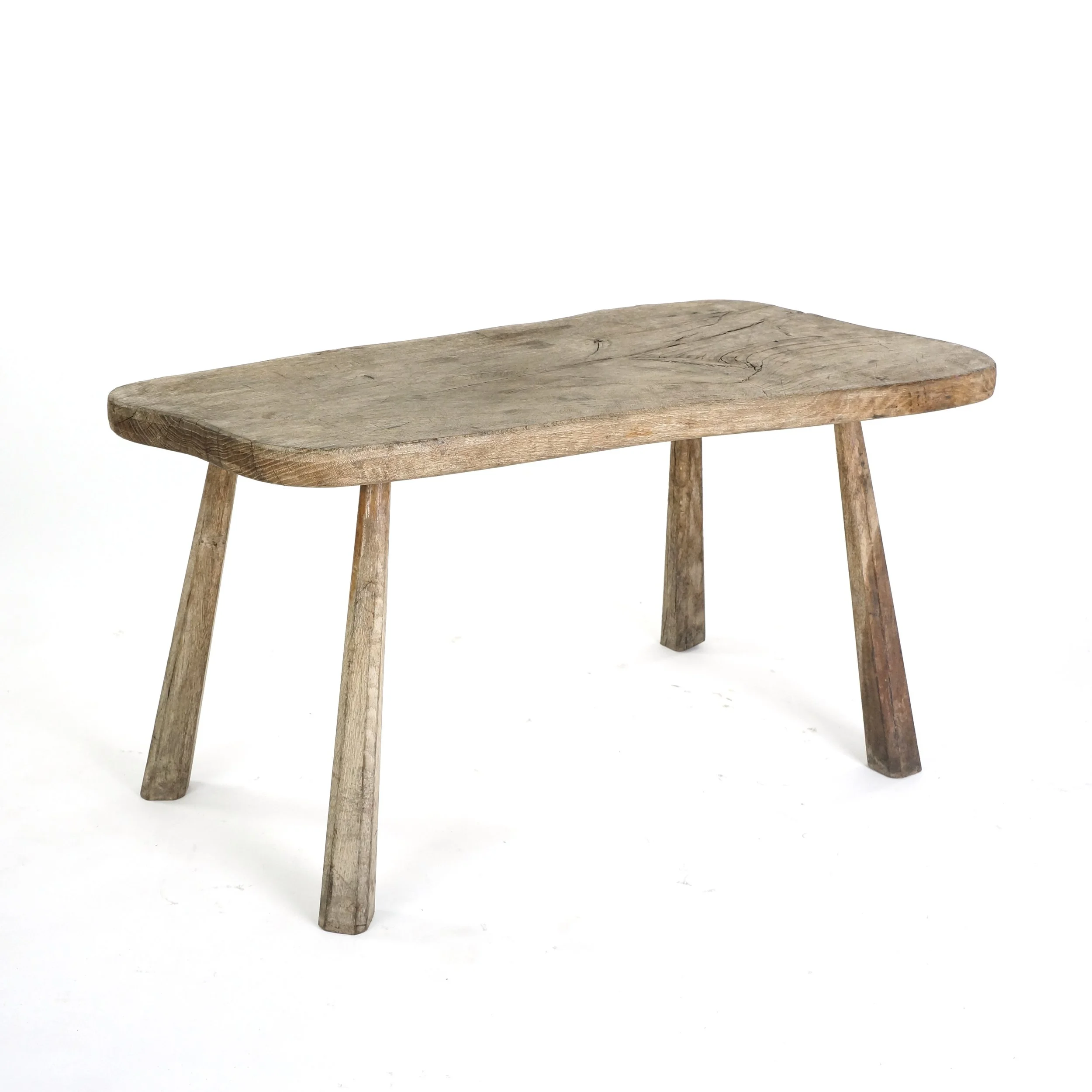 A 19TH CENTURY ELM PIG BENCH