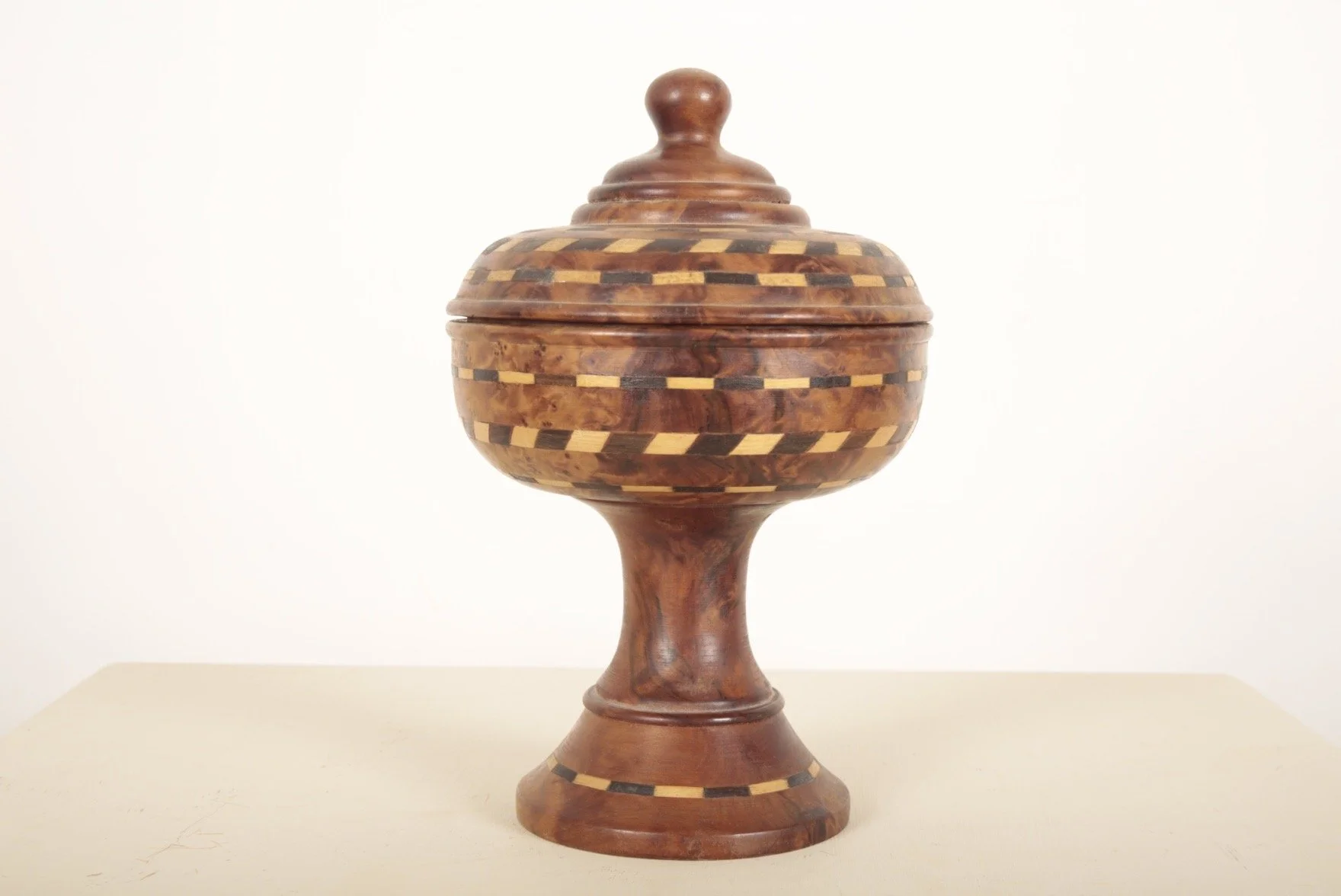 A VICTORIAN TURNED BURR WALNUT URN