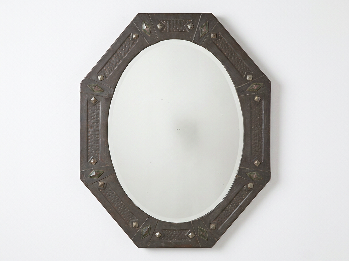 AN ARTS & CRAFTS PEWTER MIRROR